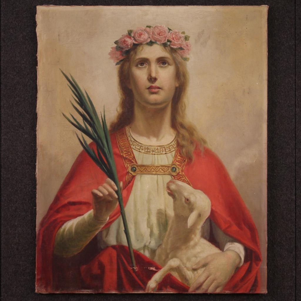 Bright Italian painting from the early 20th century. Artwork oil on canvas, on the first canvas, depicting a religious subject Saint Agnes of excellent pictorial quality. Nice size and pleasantly furnished artwork characterized by bright colors on a