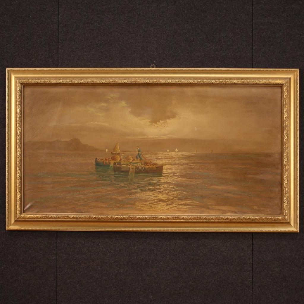 Italian painting from the 20th century. Framework oil on canvas depicting landscape, seascape with boats and fishermen at sunrise of good pictorial quality. Finely gilded and chiselled wood and plaster frame, beautifully decorated. Framework of good