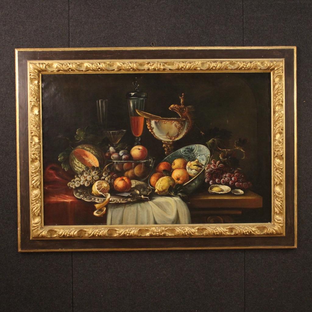 Great Italian painting from the second half of the 20th century. Oil painting on canvas in antique style of exceptional quality and decor depicting rich still life with fruit, oysters, ceramic plates and various types of wine glasses. Large impact