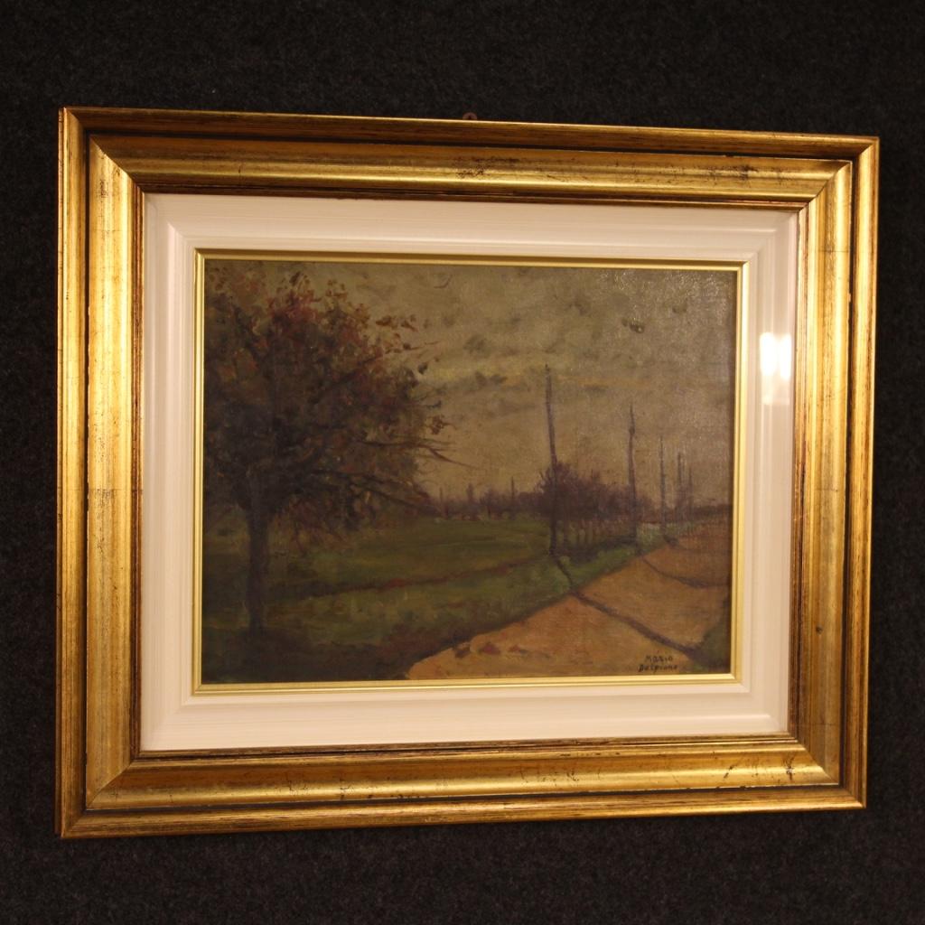 Italian painting from 20th century. Oil painting on a panel depicting an Impressionist countryside landscape. Carved and gilded wooden frame equipped with lacquered passe-partout and protective glass. Small size framework, signed on the bottom right