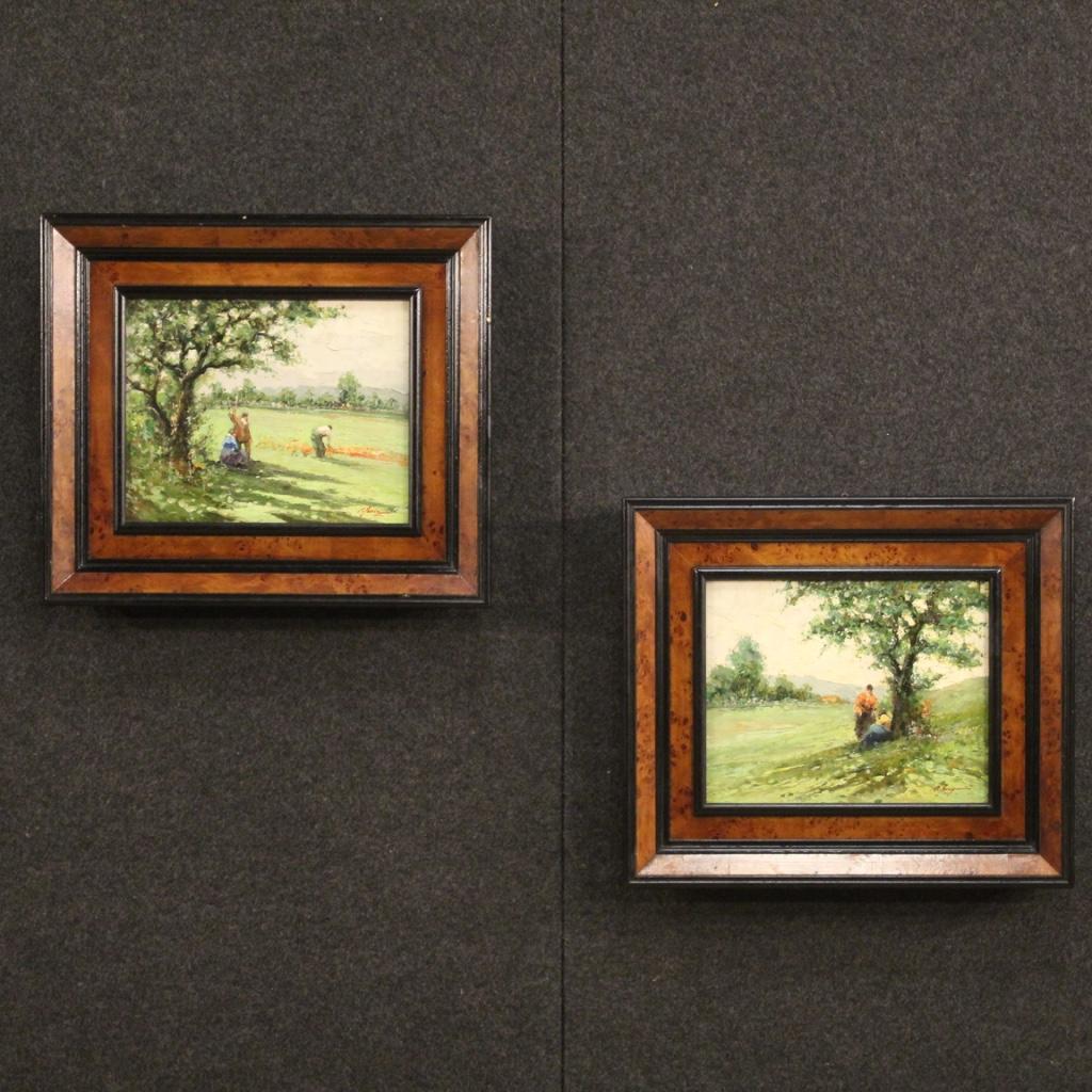 Pretty Italian painting from the second half of the 20th century. Oil painting on panel depicting a pleasant countryside landscape view with characters in impressionist style. Framework with a modern ebonized wooden frame and embellished with burl