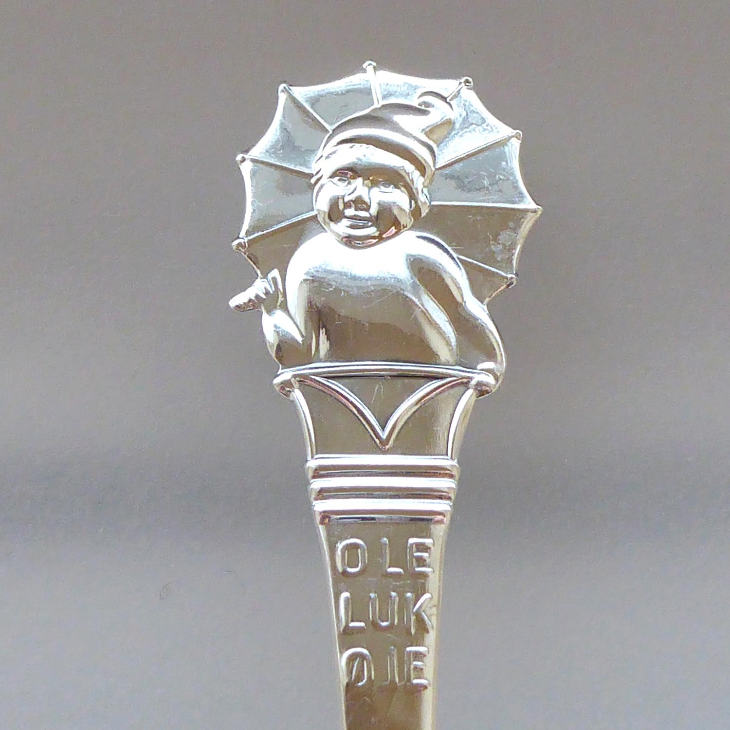 A delightful children's silver spoon featuring the Scandinavian fairytale character, Ole Lukoje, which translates as 