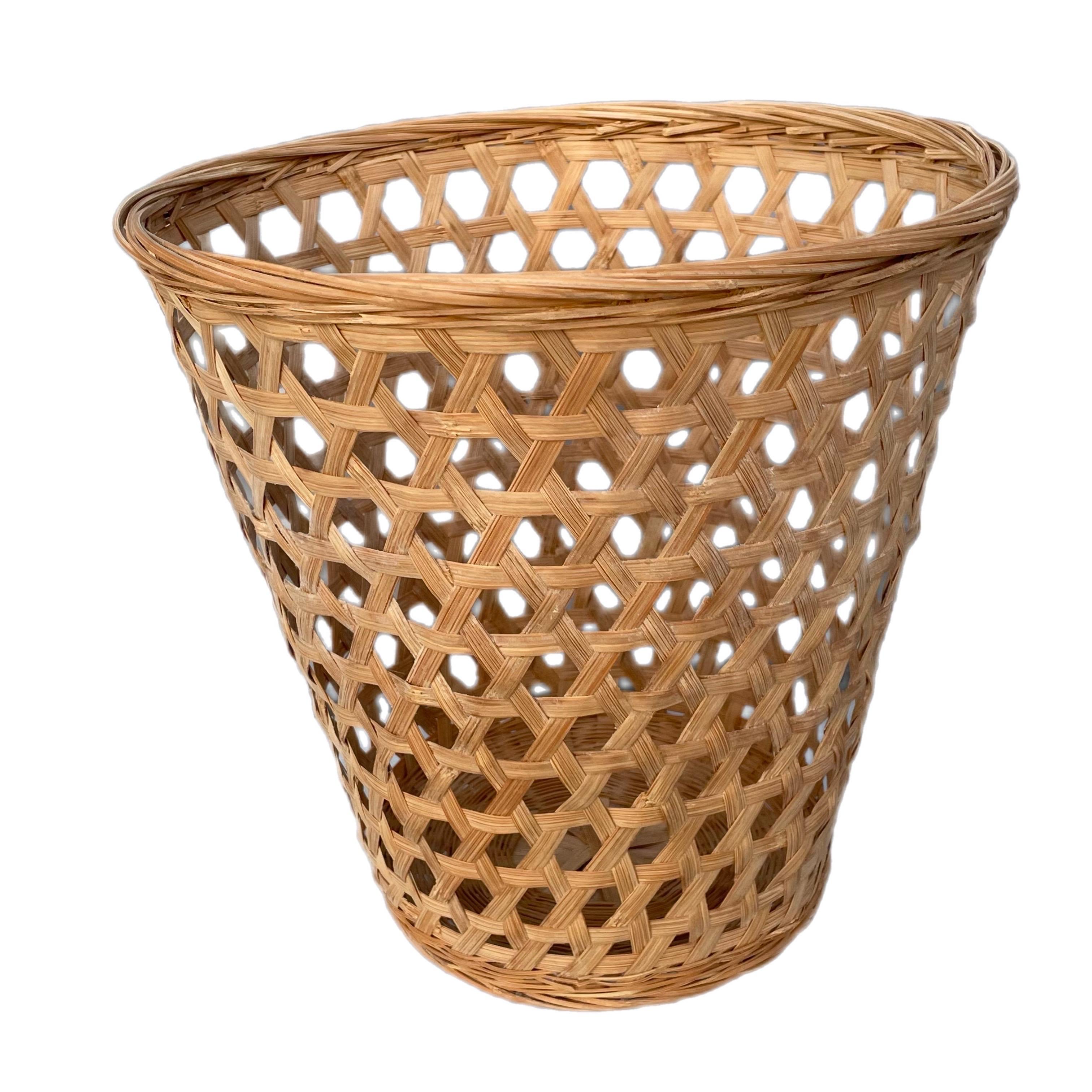 A lovely wastebasket with an open weave style. The base is a closed weave, so to keep the contents inside secure. Some wear to the basket, however overall the item is in good, functional, and aesthetically pleasing condition. I'd date the basket to