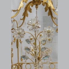 Opulent Rock Crystal Chandelier with foliage and ribbon motif