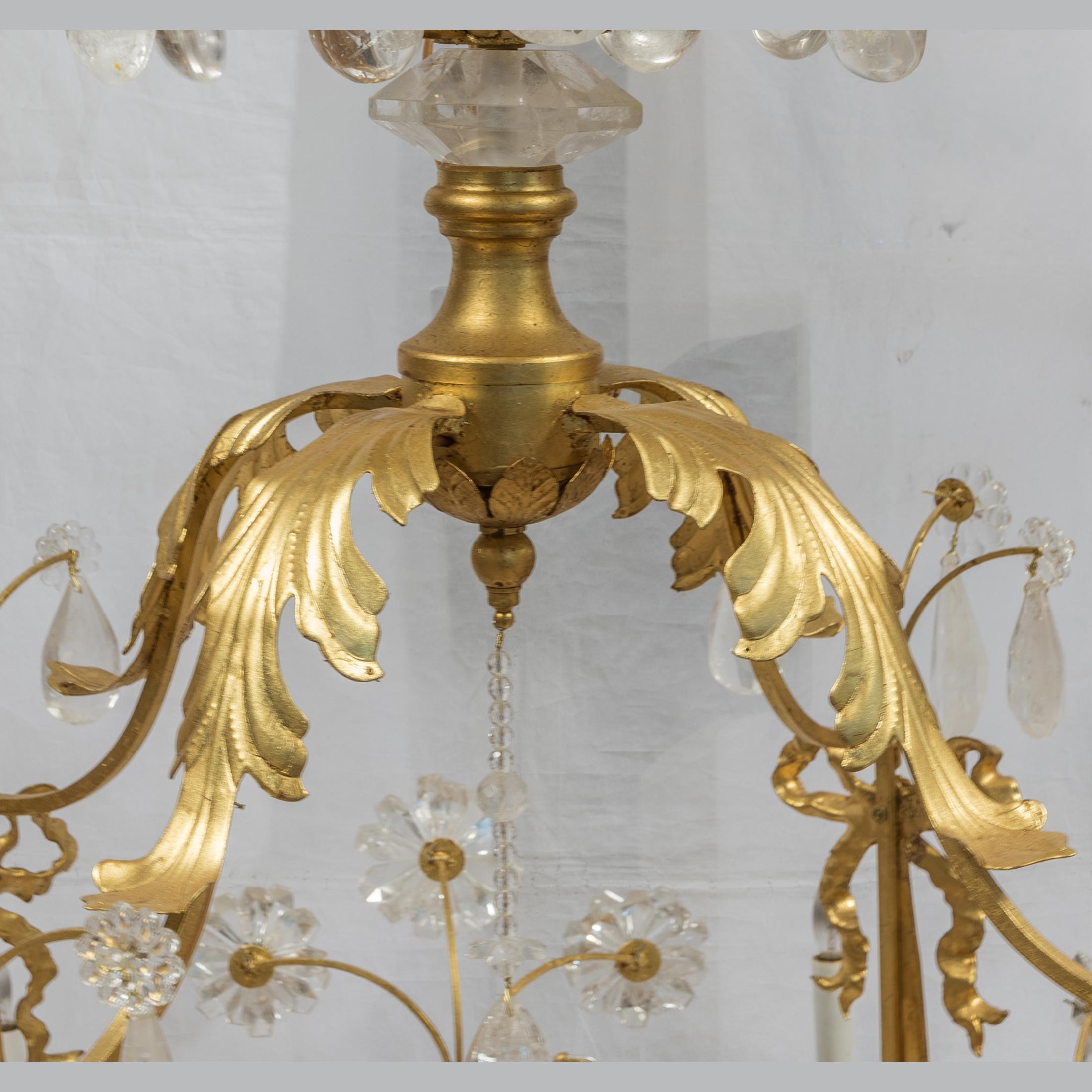 Gilt 20th Century Opulent Rock Crystal Chandelier with foliage and ribbon motif For Sale