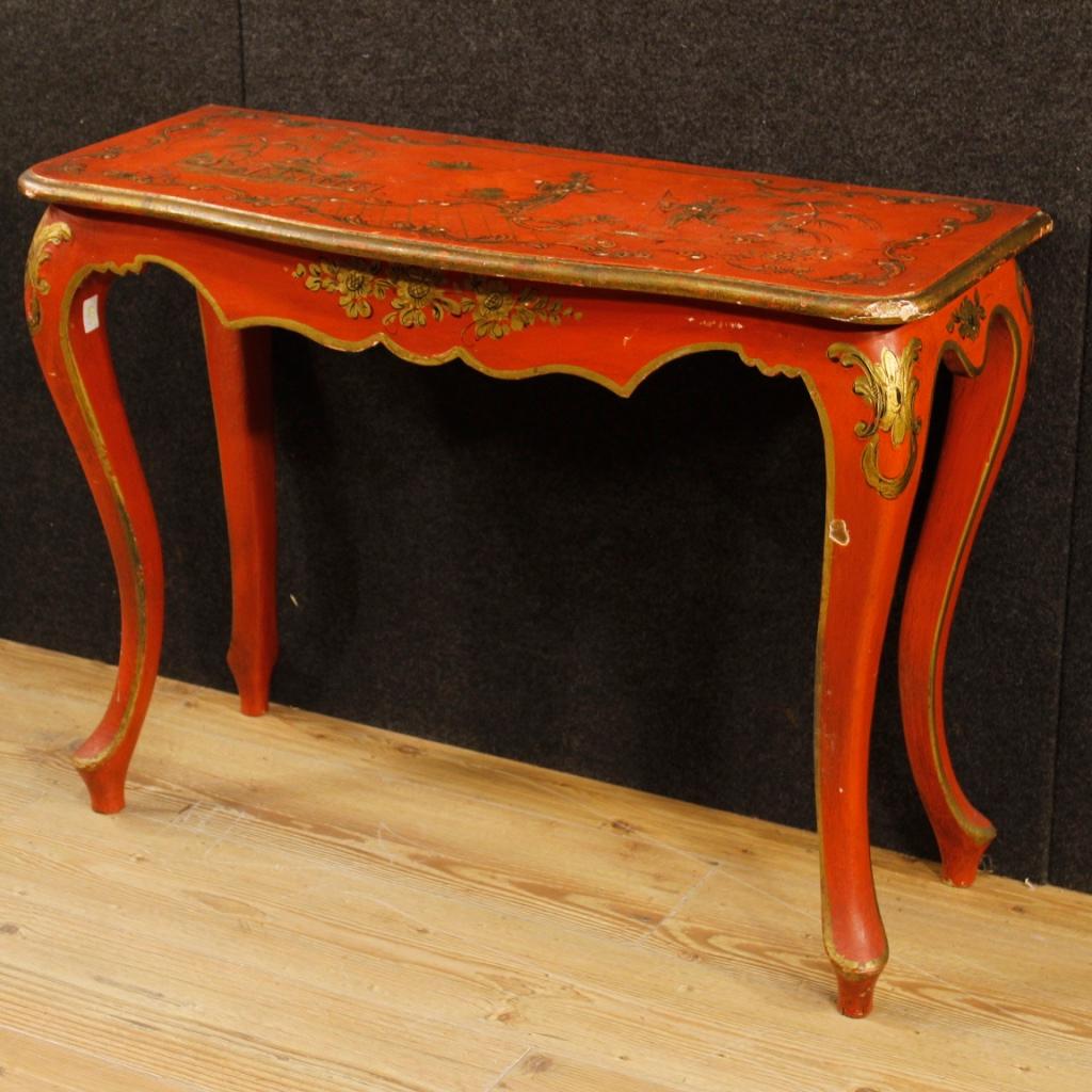 Spanish console from the second half of the 20th century. Furniture in wood with richly chinoiserie golden and lacquered plywood elements. Console of small measure with top of discrete measure and service. Furniture that can be easily inserted into