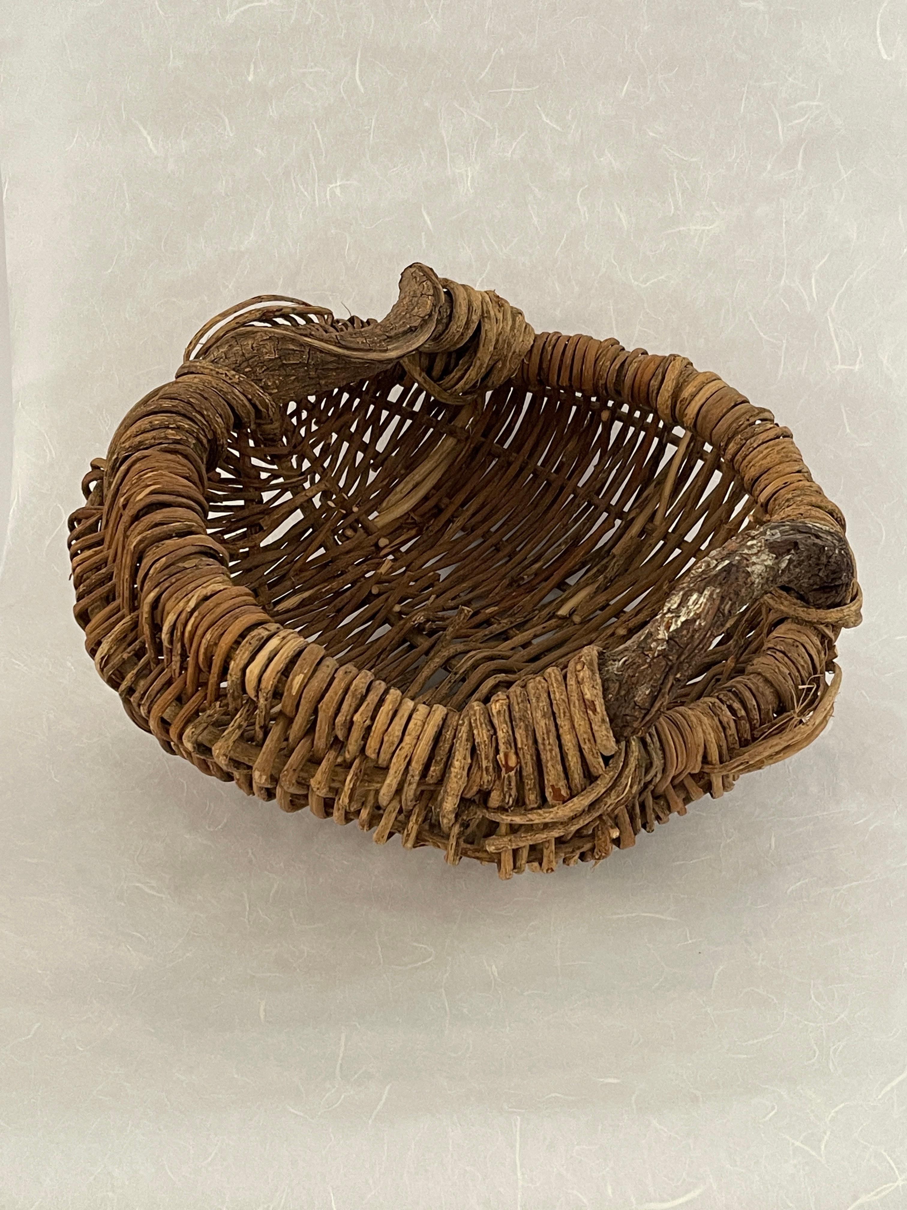 20th Century Organic Handled Woven Basket with free form curved branch handles and a wicker weaved body. Perfect basket for all year round or seasonal. Great piece for collecting items or display empty on any table, shelf, or floor. 
