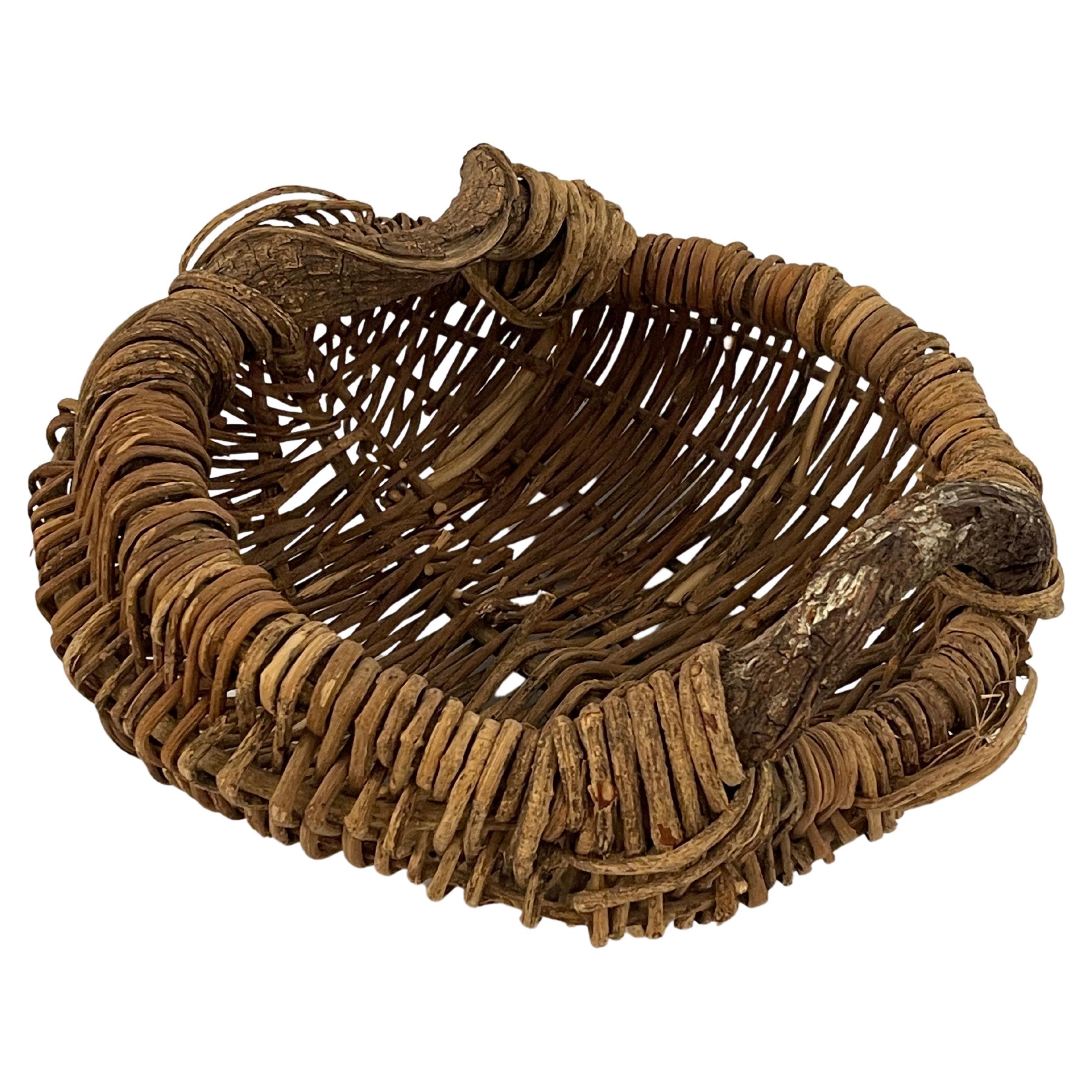 20th Century Organic Handled Woven Basket For Sale