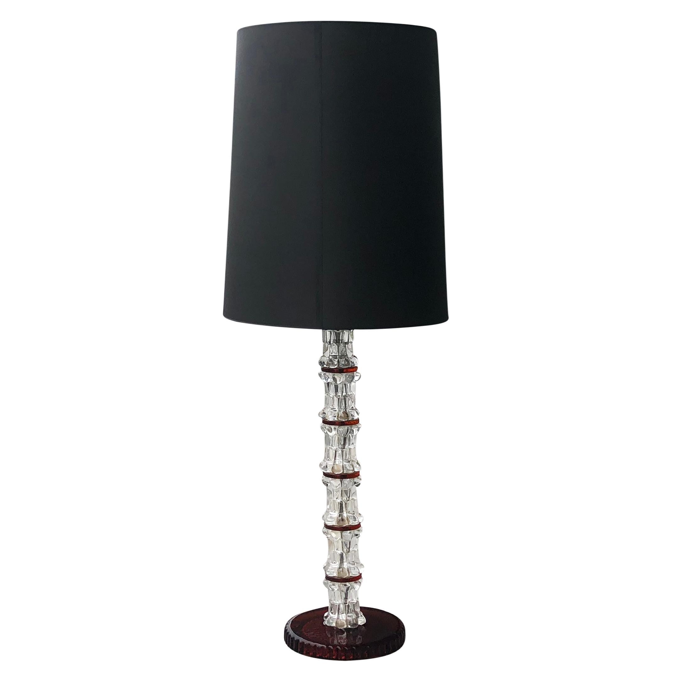 A white-red, vintage Mid-Century modern Swedish floor lamp made of hand blown stacked crystal, Orrefors glass with a tall black shade. The Scandinavian light was designed by Carl Fagerlund and produced by Orrefors, featuring a one light socket in