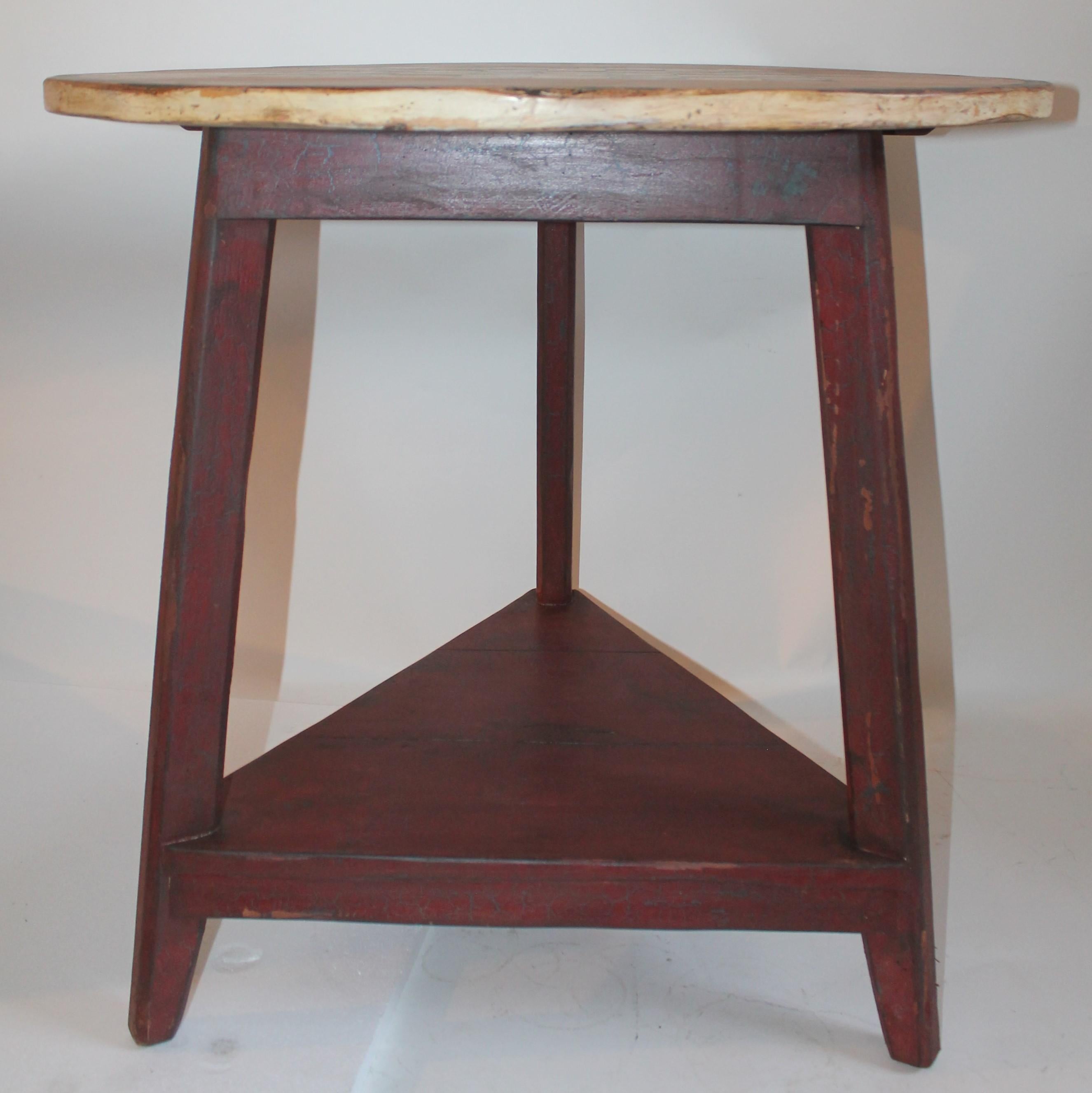 This fun three legged checker board gaming table is in good, sturdy condition and is from the 1920s or 1930s. It is made to look like a 18th century cricket table. It is in great condition with wear on top in areas.