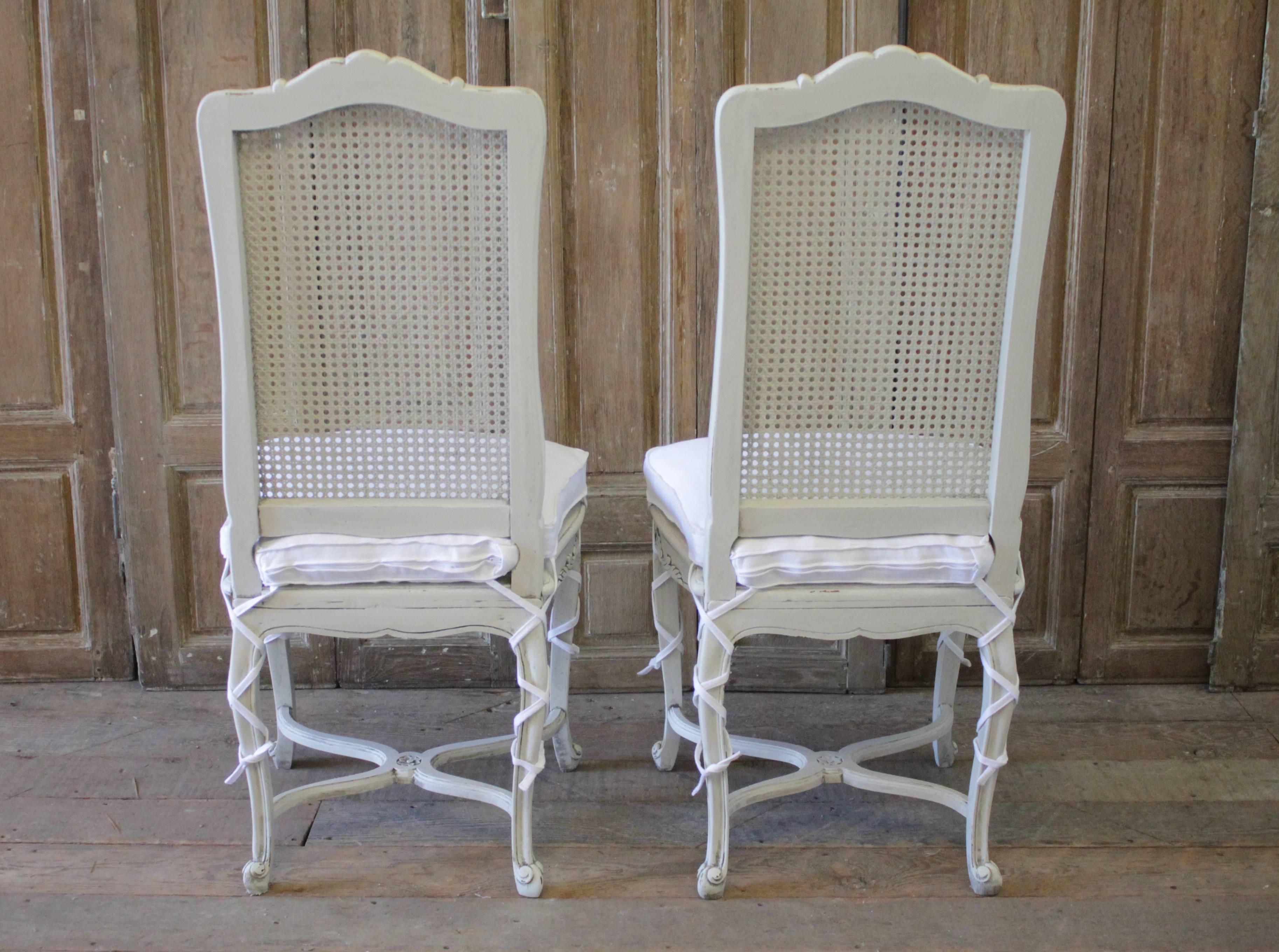 20th Century Painted Louis XV Style Cane Back Dining Chairs with Linen Cushions 1