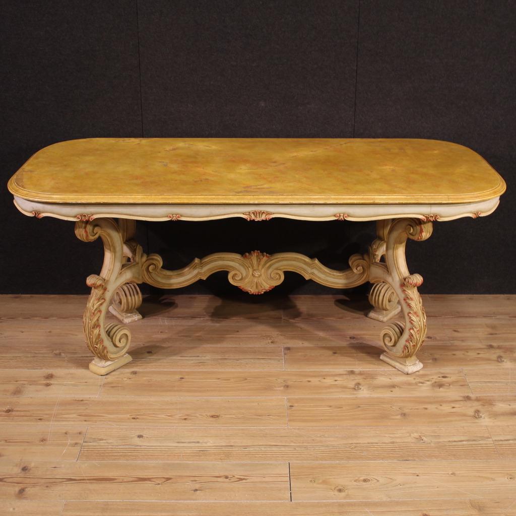 1960s Venetian style dining table. Furniture of great decoration in richly carved and painted wood. Lacquered faux marble top with some scratches and signs of wear (see photo). Table of nice size and good service, ideal for a large dining room or