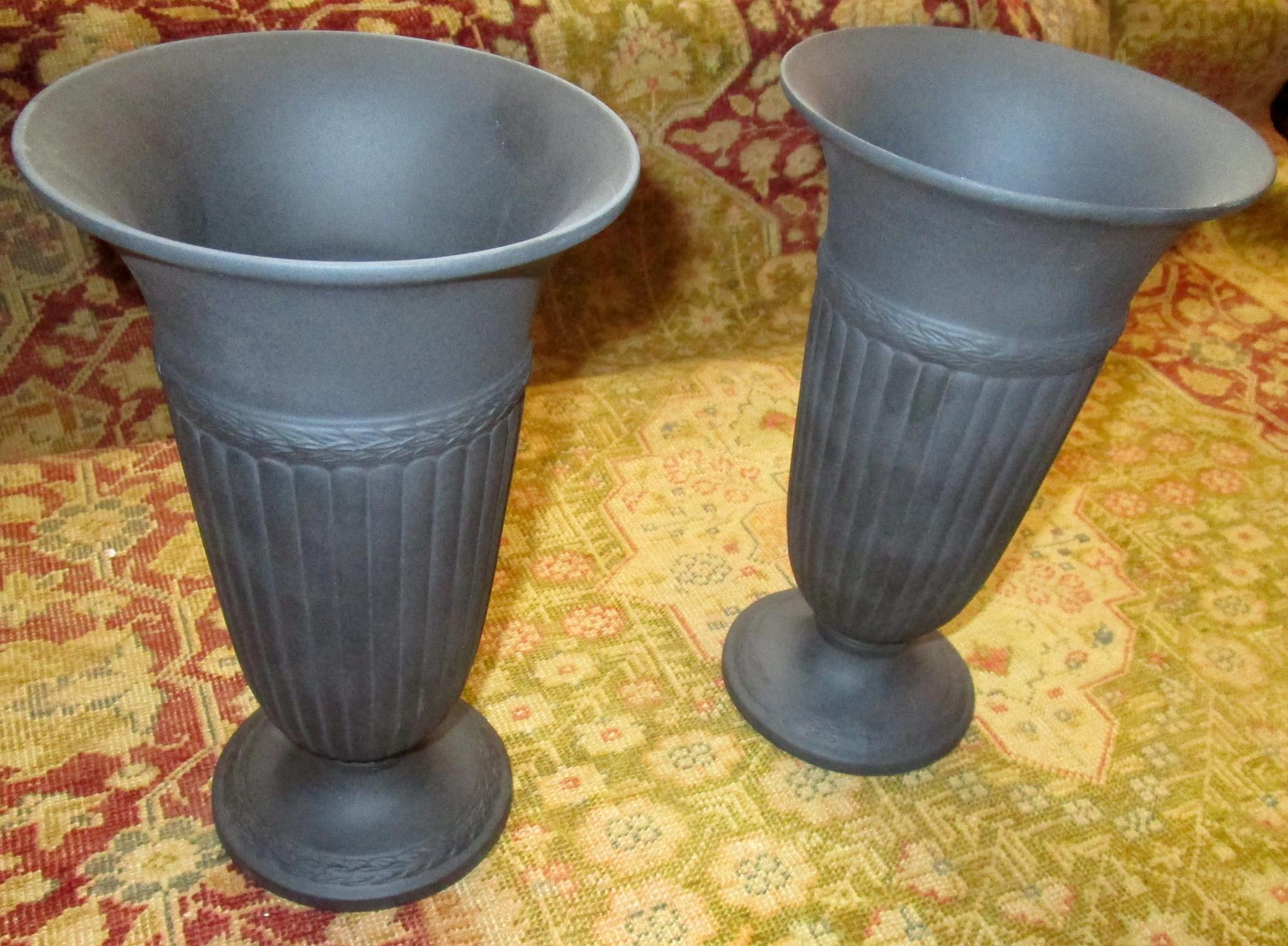 Pair of black basalt Edme Wedgwood vases, the Wedgwood Edme design is reminiscent of the ridges of a clam shell, harking back to Josiah Wedgwood's love of shell collecting. This handsome pair are of a simple style with a laurel wreath around the