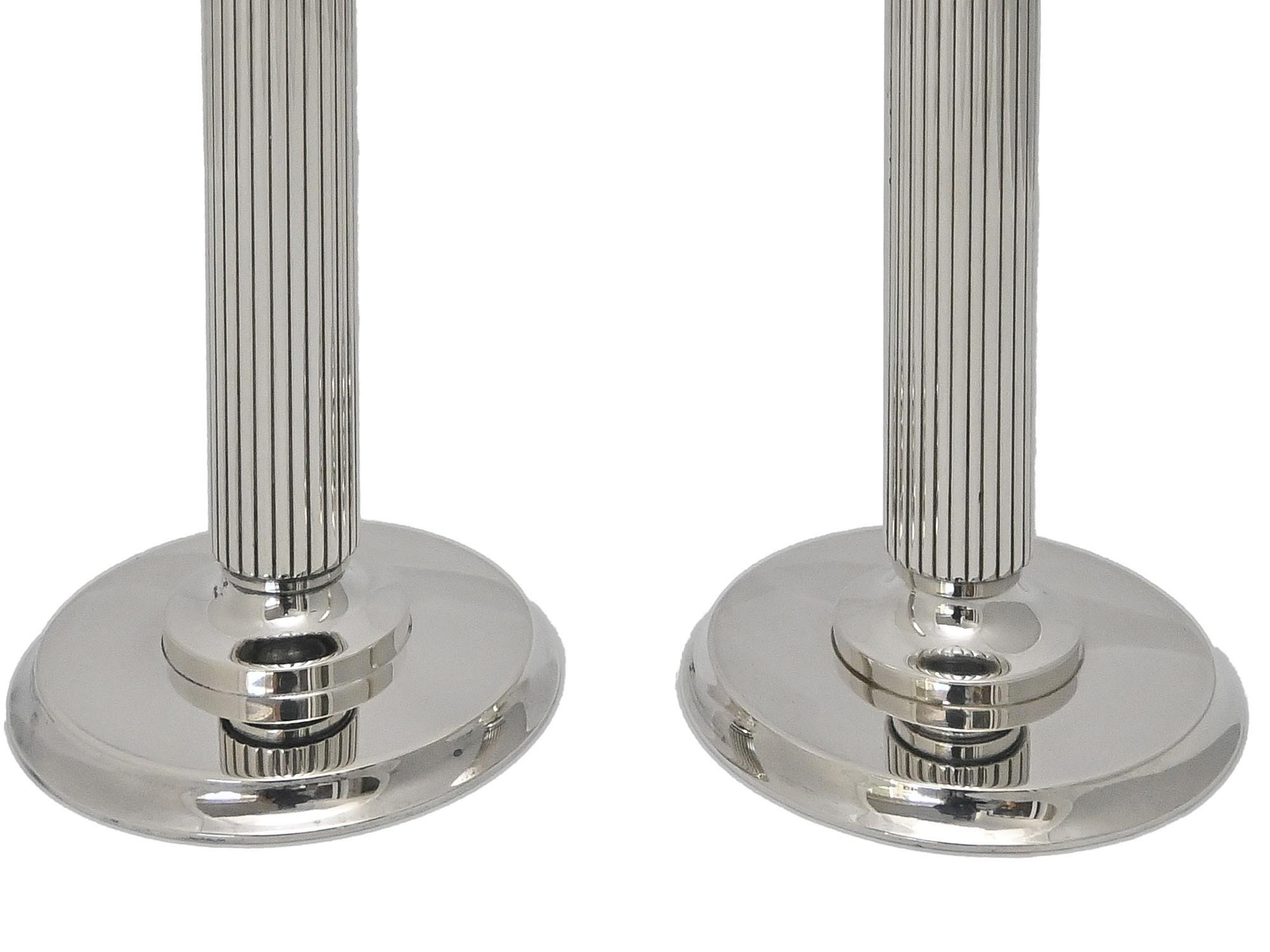 Pair of candlesticks 855 E by Georg Jensen Denmark , design Prince Sigvard Bernadotte  
The straight design and particular style, without any other decorations than the lines of the ribs shows Sigvard Bernadotte as one of the first modern designers