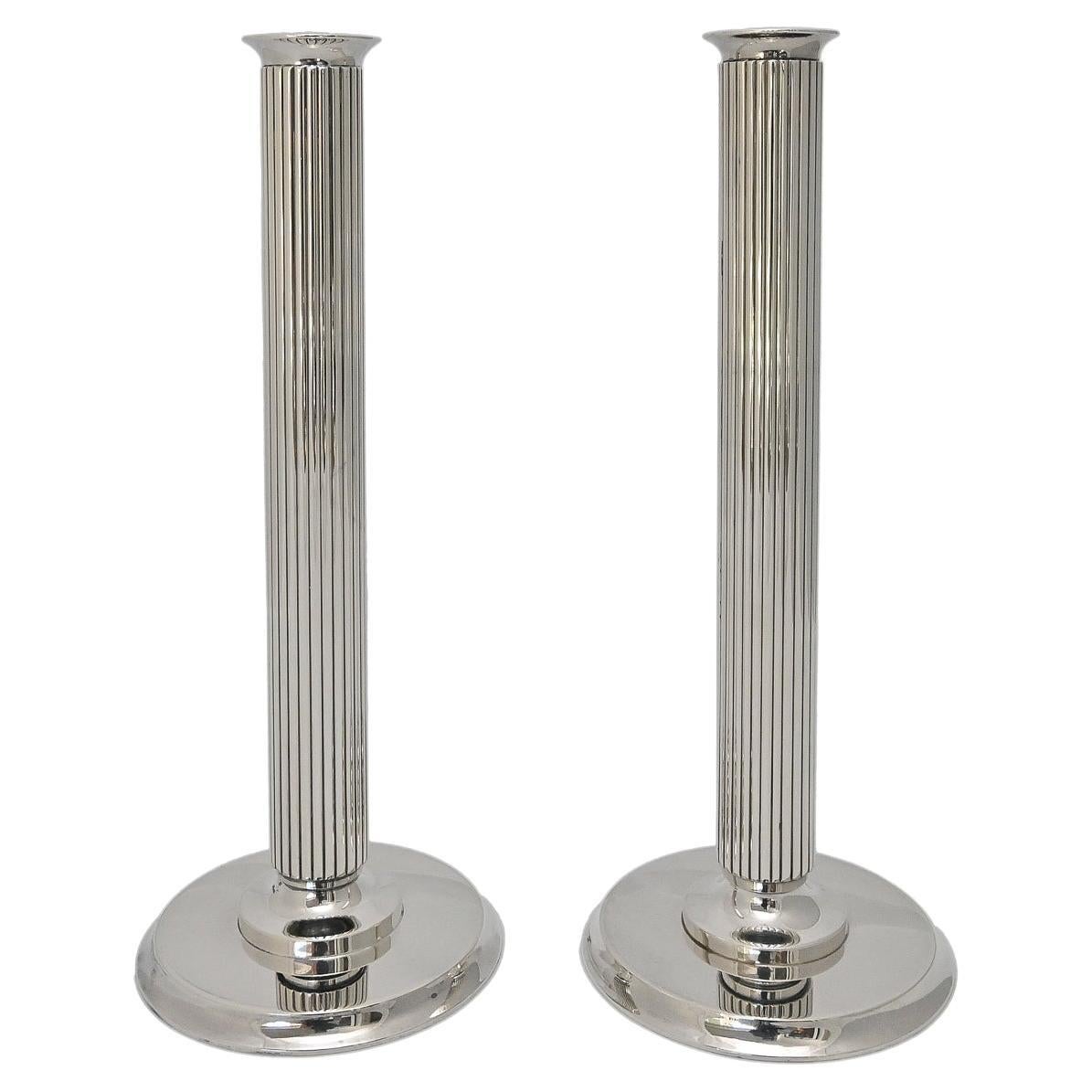 https://a.1stdibscdn.com/20th-century-pair-candle-holders-855b-georg-jensen-sigvard-bernadotte-sterling-for-sale/f_52432/f_360670421694164502752/f_36067042_1694164503062_bg_processed.jpg