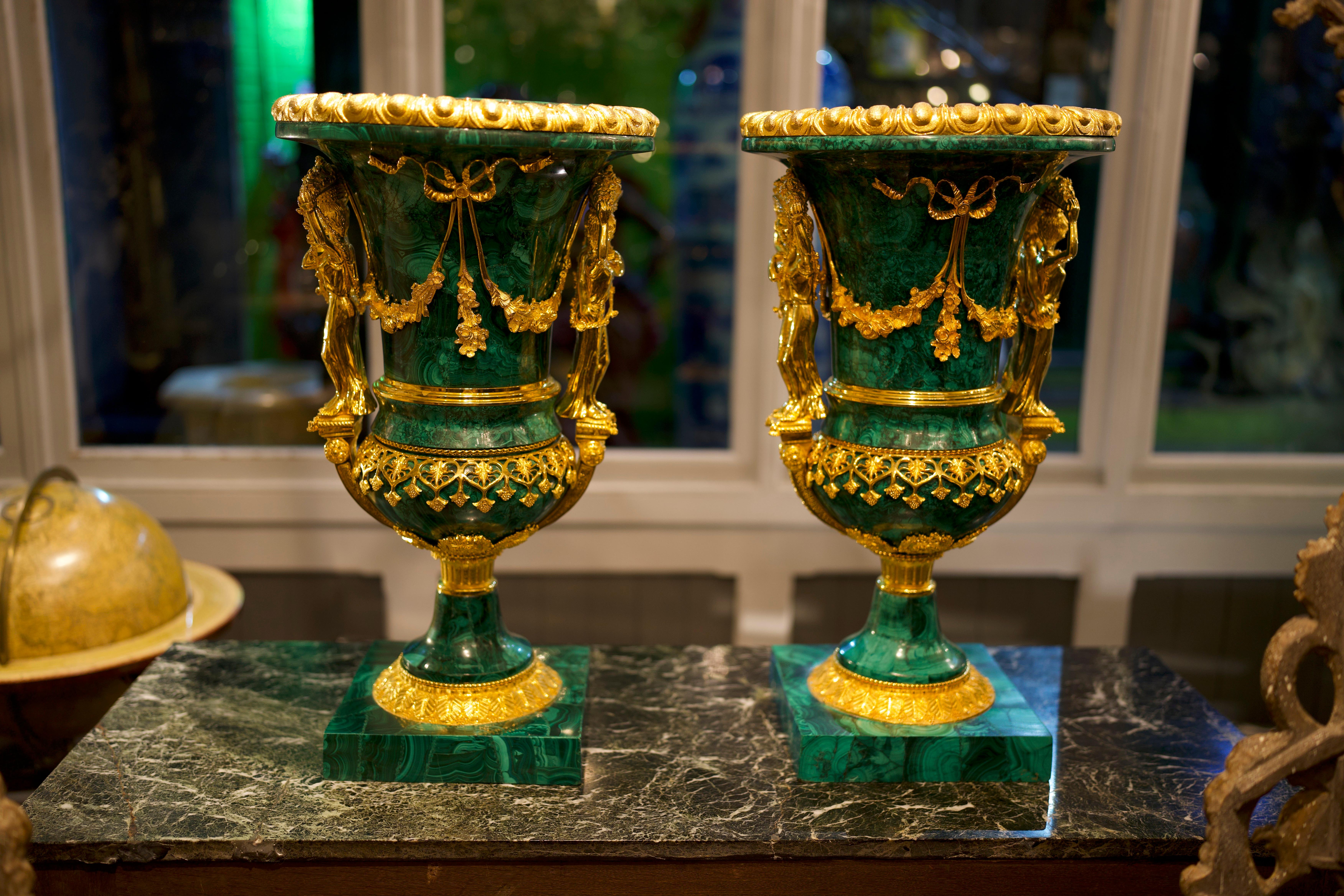20th century pair Malachite Urns.

An very high quality pair of Belle Époque style gilt bronze and malachite urns. Each with Berainesque gilt bronze tracery cast everted rim above a vessel mounted with oval plaques within acorn and oak leaf