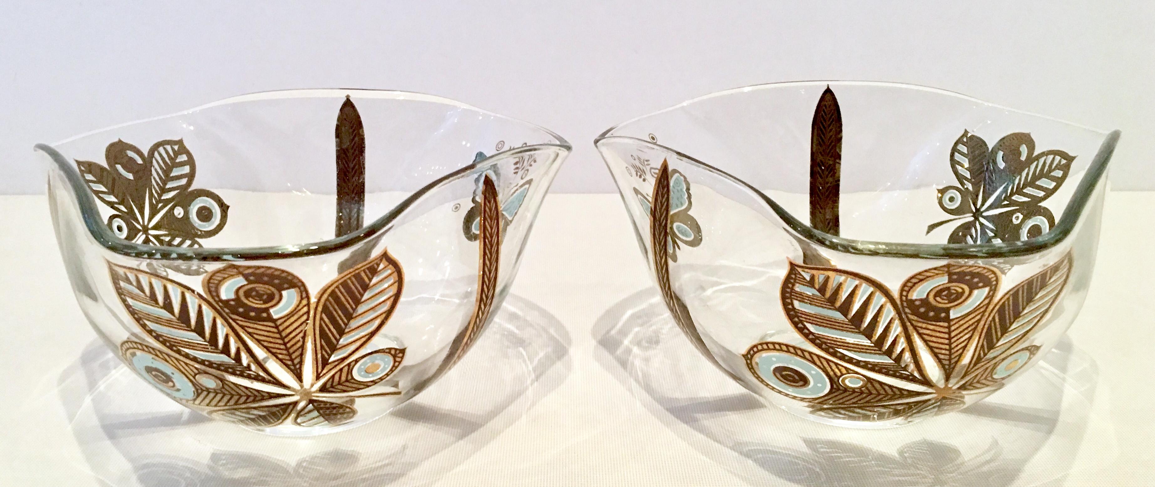 20th century Hollywood Regency pair of 22-karat gold printed organic form butterfly motif glass bowls by, Georges Briard. Each piece is signed on the exterior bottom with the Geroges Briard Trademark.