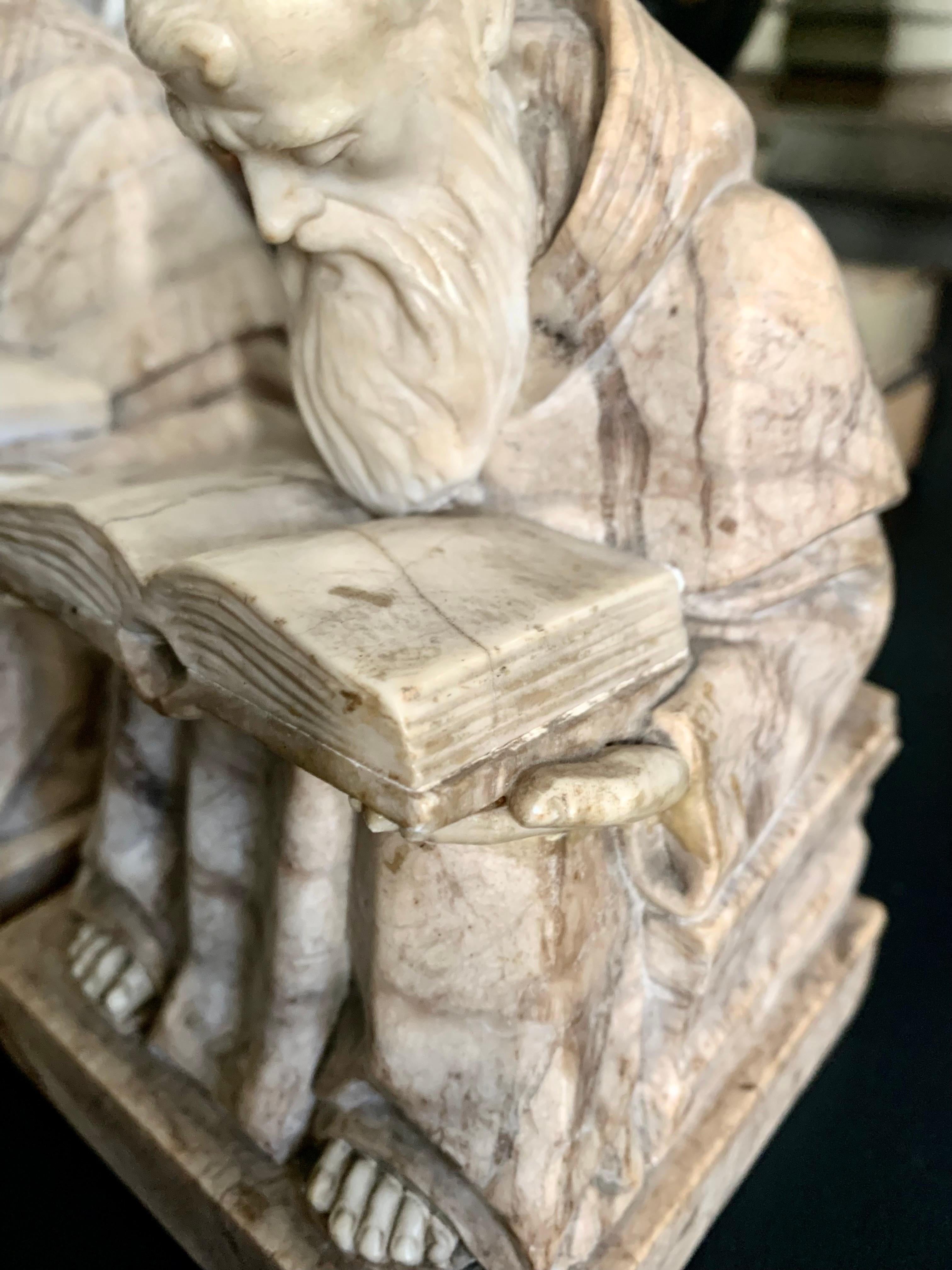 Alabaster and marble bookends representing the figures of monks seated on a throne reading a book in the medieval style, made of marble and alabaster

They have a great quality of work in alabaster that can be seen in the figures of the heads,