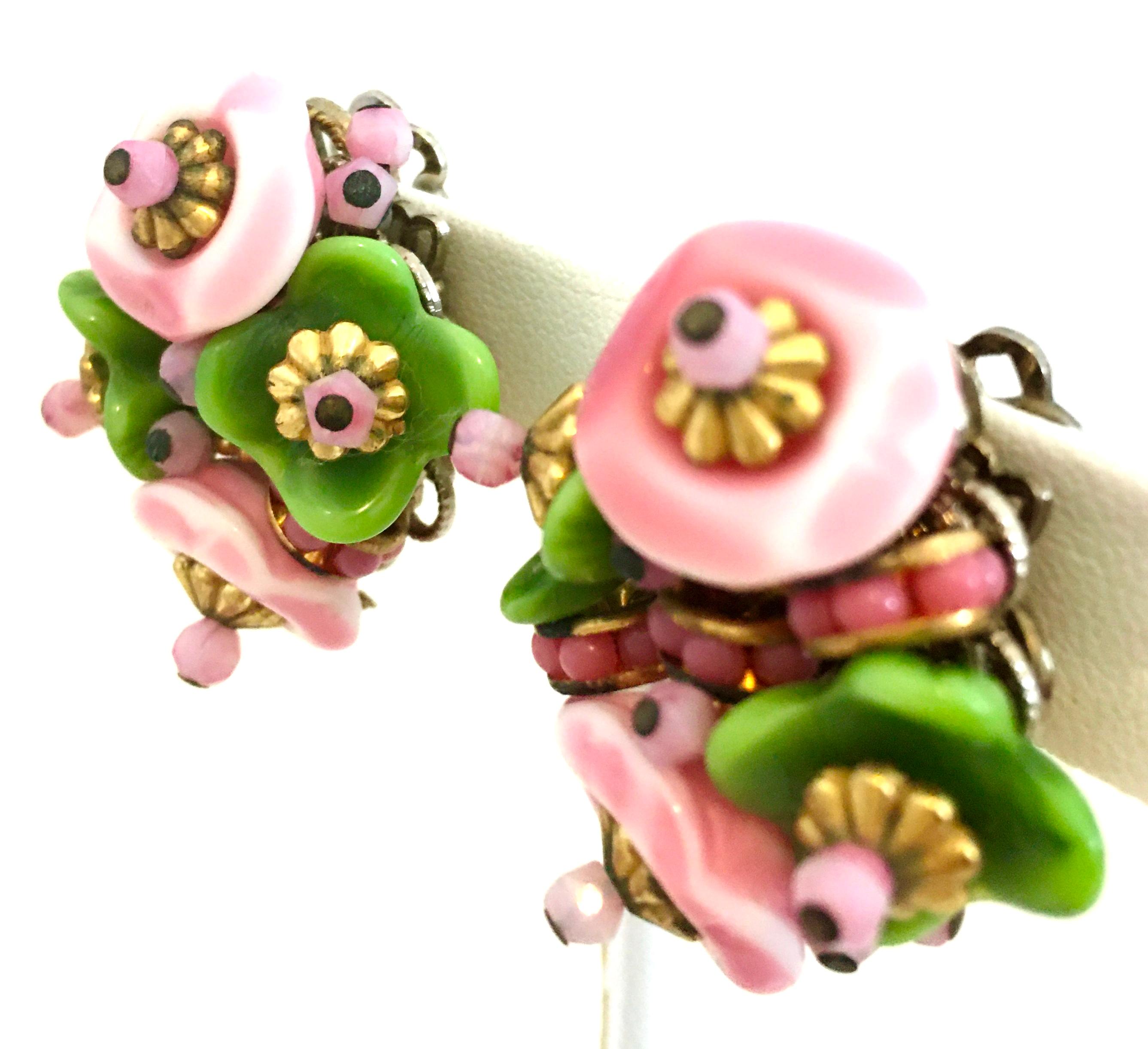 20th Century Pair Of Alice Caviness Abstract Flower Earrings-Signed. These unique and whimsical earrings are made of hand painted ceramic with a mix of glass beads and gold tone accents. The back of each earrings is silver plate and each signed