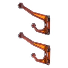 Vintage 20th Century Pair of Amber Translucent Plastic Wall Hooks