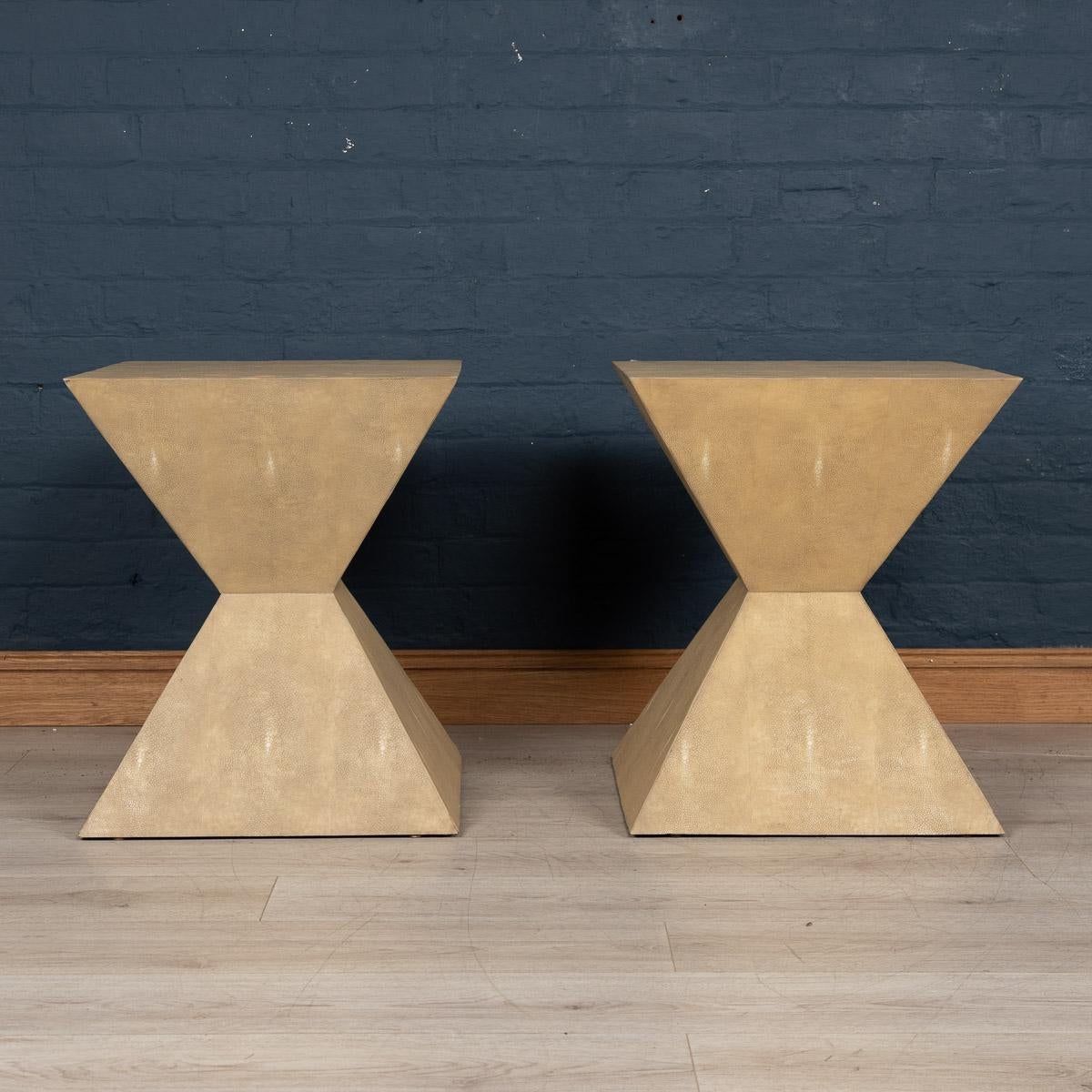 A lovely pair of Art Deco inspired side tables, by Julian Chichester, London. Made in the latter part of the last century, veneered in faux shagreen. Shagreen is an exotic shark skin often used on Art Deco furniture of the 1930s, highly prized