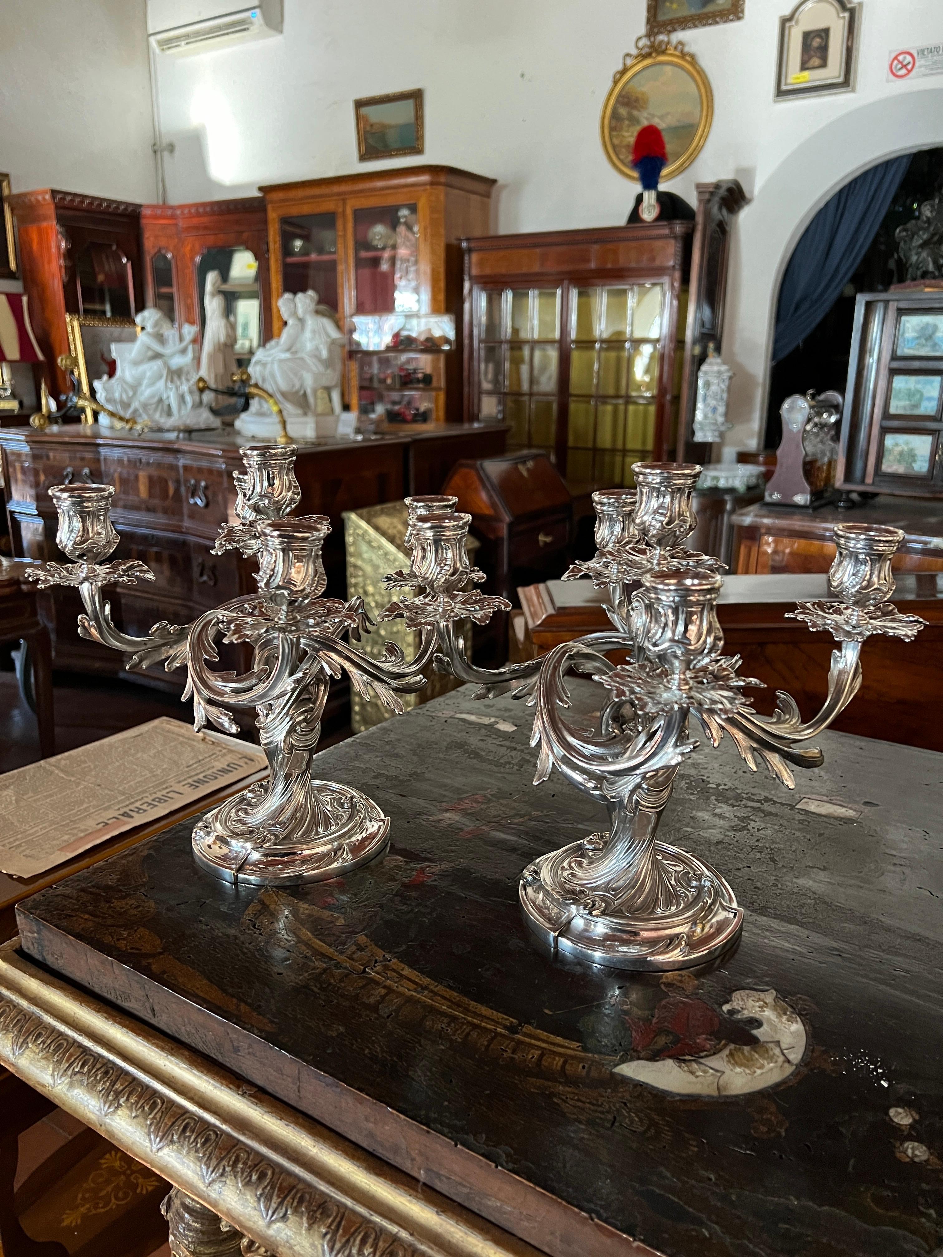 Fantastic Pair of Candelabras signed Christofle, first years of XX century,finely wrought , the structure looks like a moving plant that wraps around itself, 5 arms, initialed in the bottom with the Christofle symbol and serial. In silver-plated