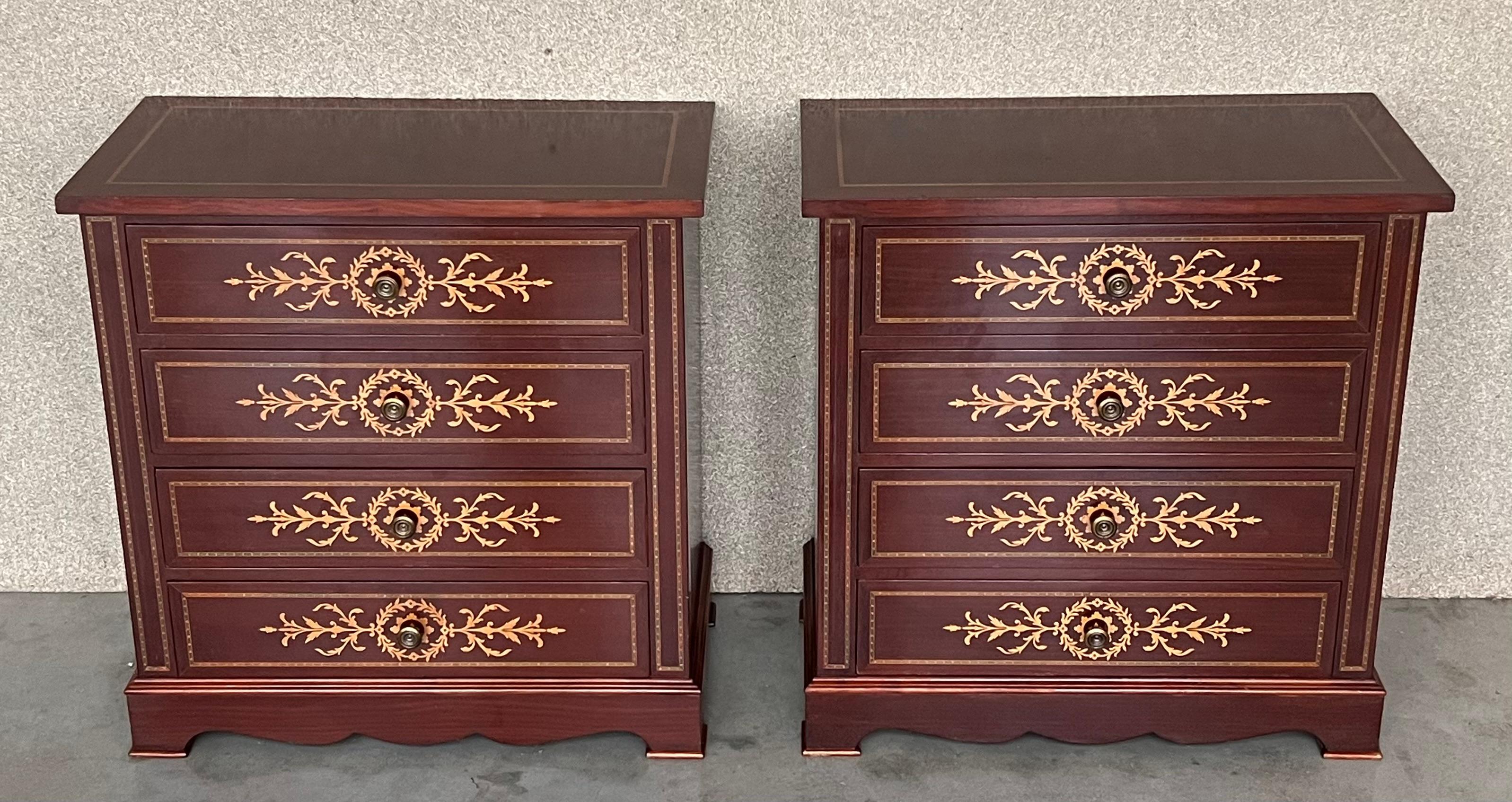 20th Century pair of Catalan, Spanish nightstands with four marquetry drawers and bronze hardware.


