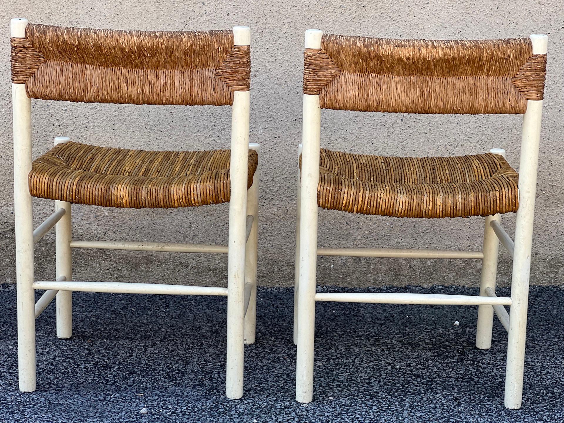 Pair of chairs Dordogne edition Robert Sentou, 1950
. Wooden structure painted white, seat and back in straw weaving. Seats redone. 
Dimensions: height: 76 cm
Width : 47 cm
Depth: 40 cm
Seat height: 48 cm