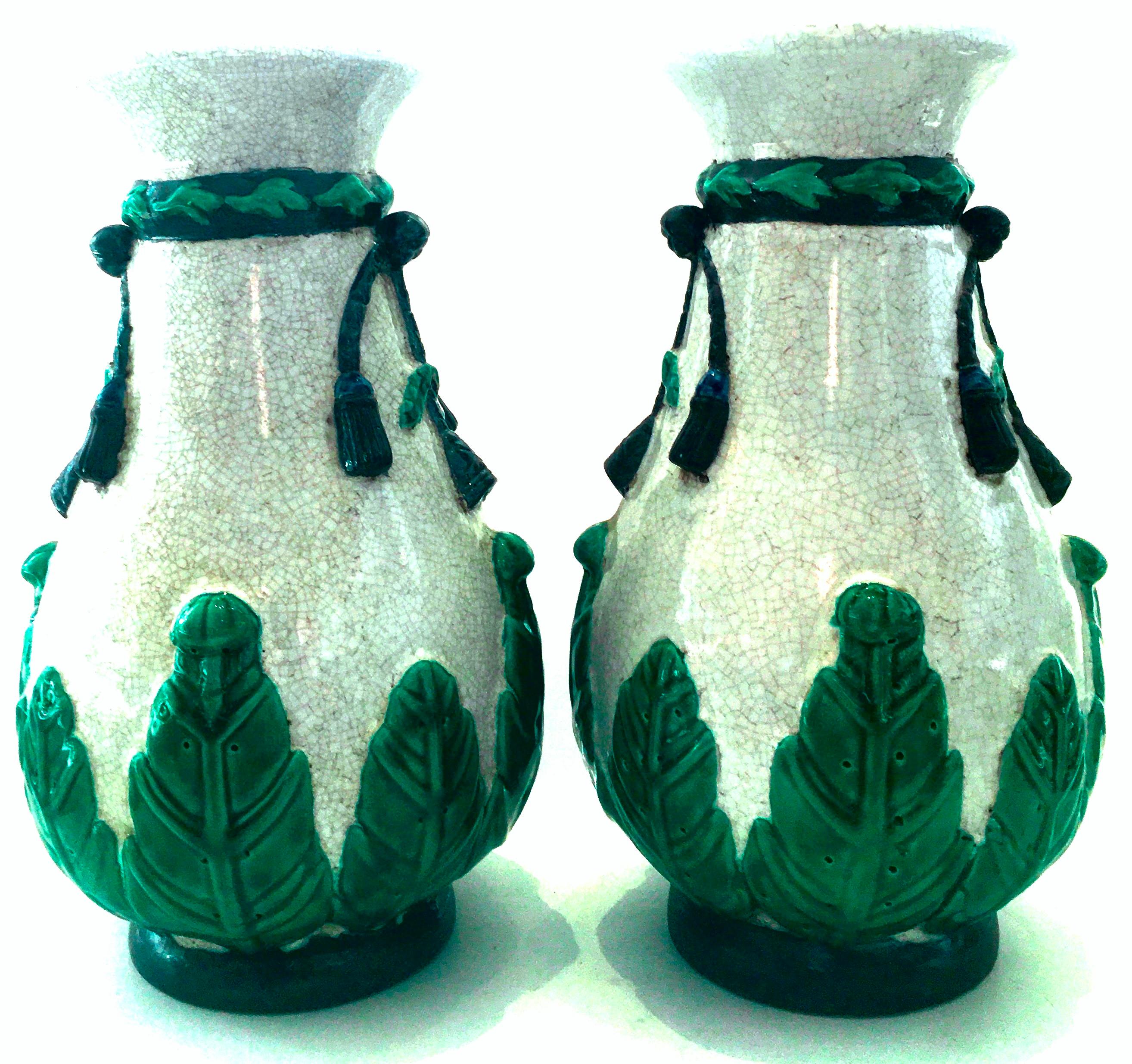20th century pair of hand crafted Chinese export crackle Majolica style vases-Signed. This unique pair of porcelain crackle vases feature applied and raised detail in the Majolica style. Hand painted glaze Tones of vivid green, brown and blue over
