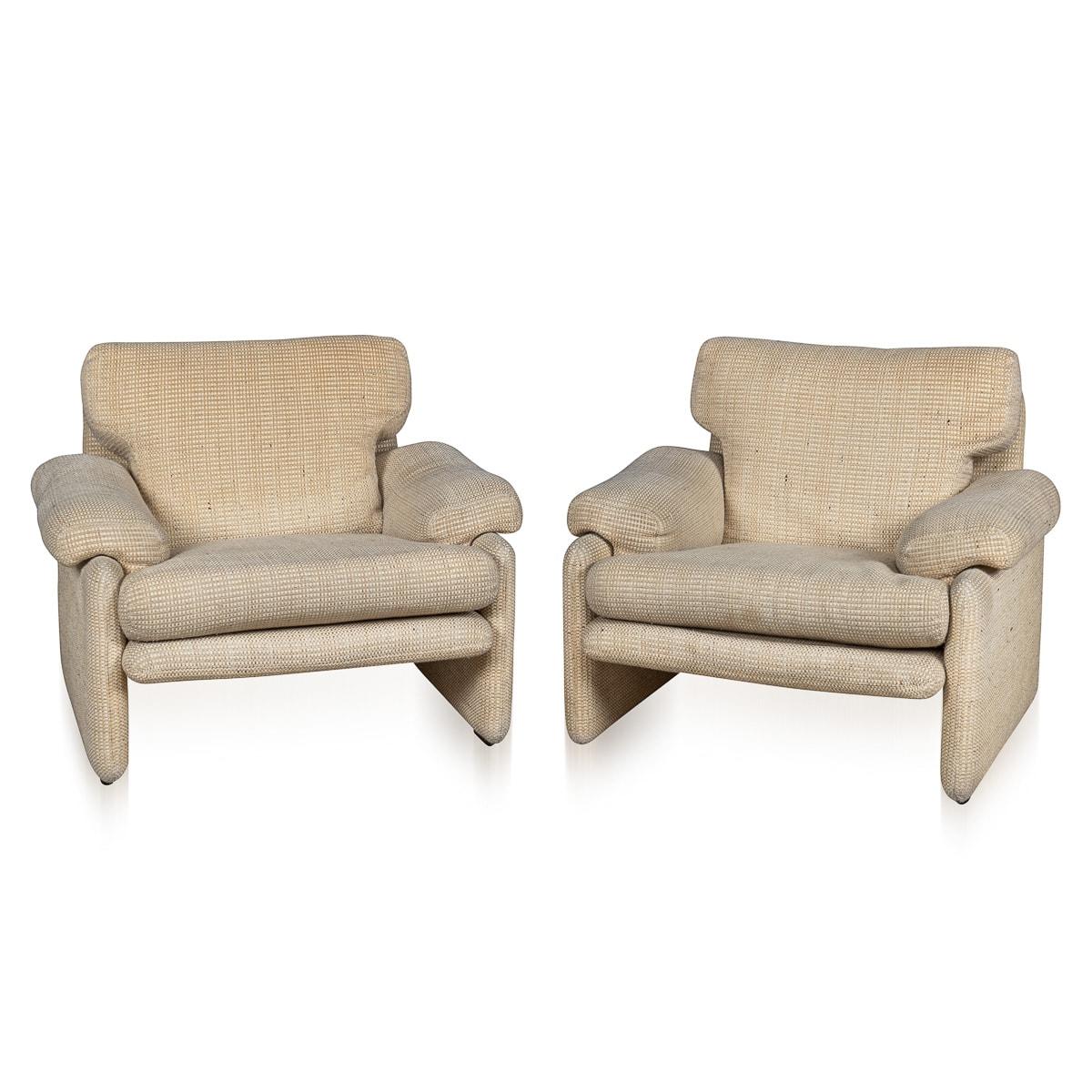 A beautiful pair of “Coronado“ armchairs designed by Tobia Scarpa for B&B Italia, crafted in Italy during the latter part of the 20th century. Embracing a refined aesthetic, these exquisite armchairs are upholstered in a mottled grey fabric that not