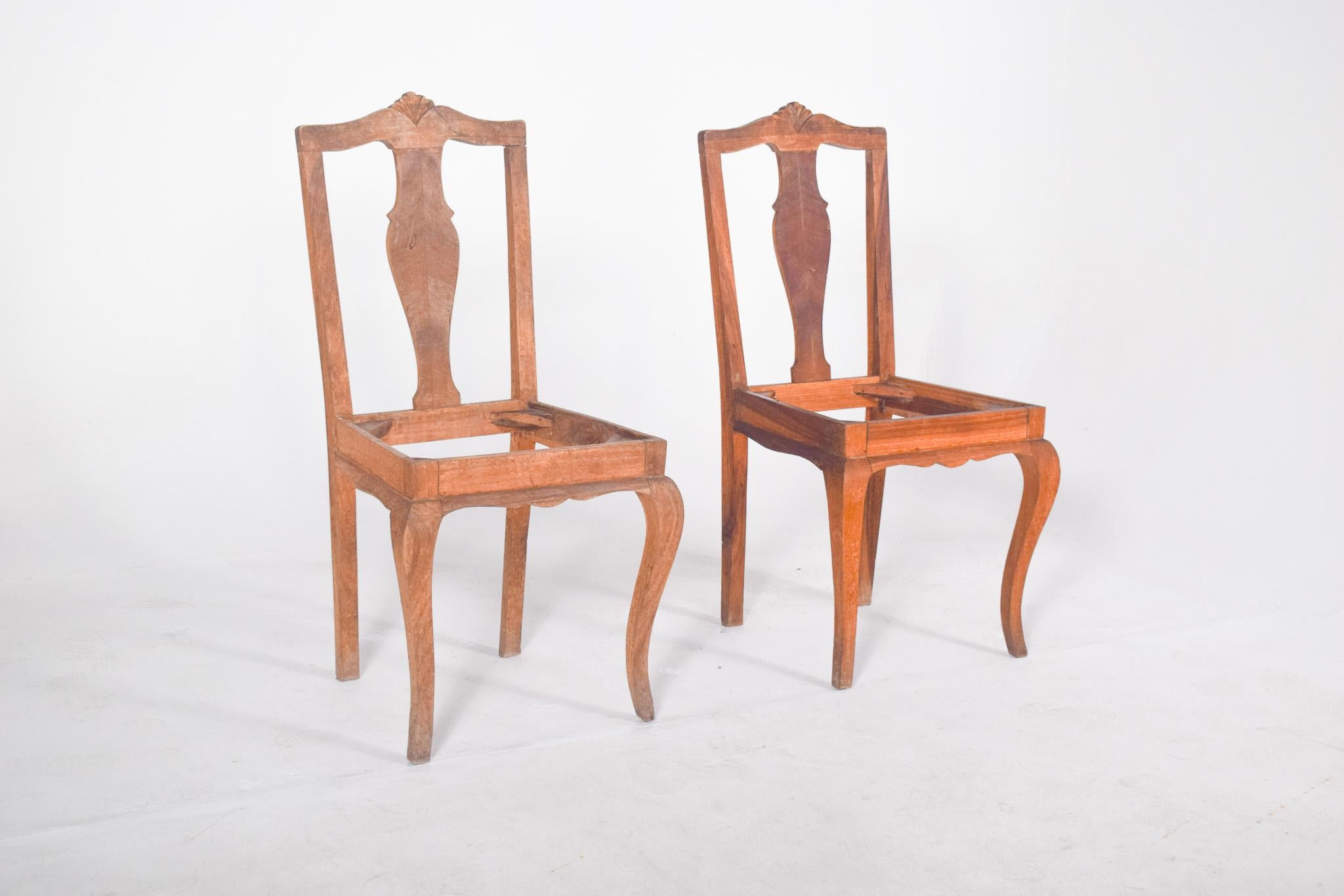 Pair of cut-out back chairs. With an elegant backrest with a cut-out central panel and a stylised shell top. The front legs are arched in the shape of a cabriole, and the lower front rail has a decorative cut-out, in keeping with the flowing