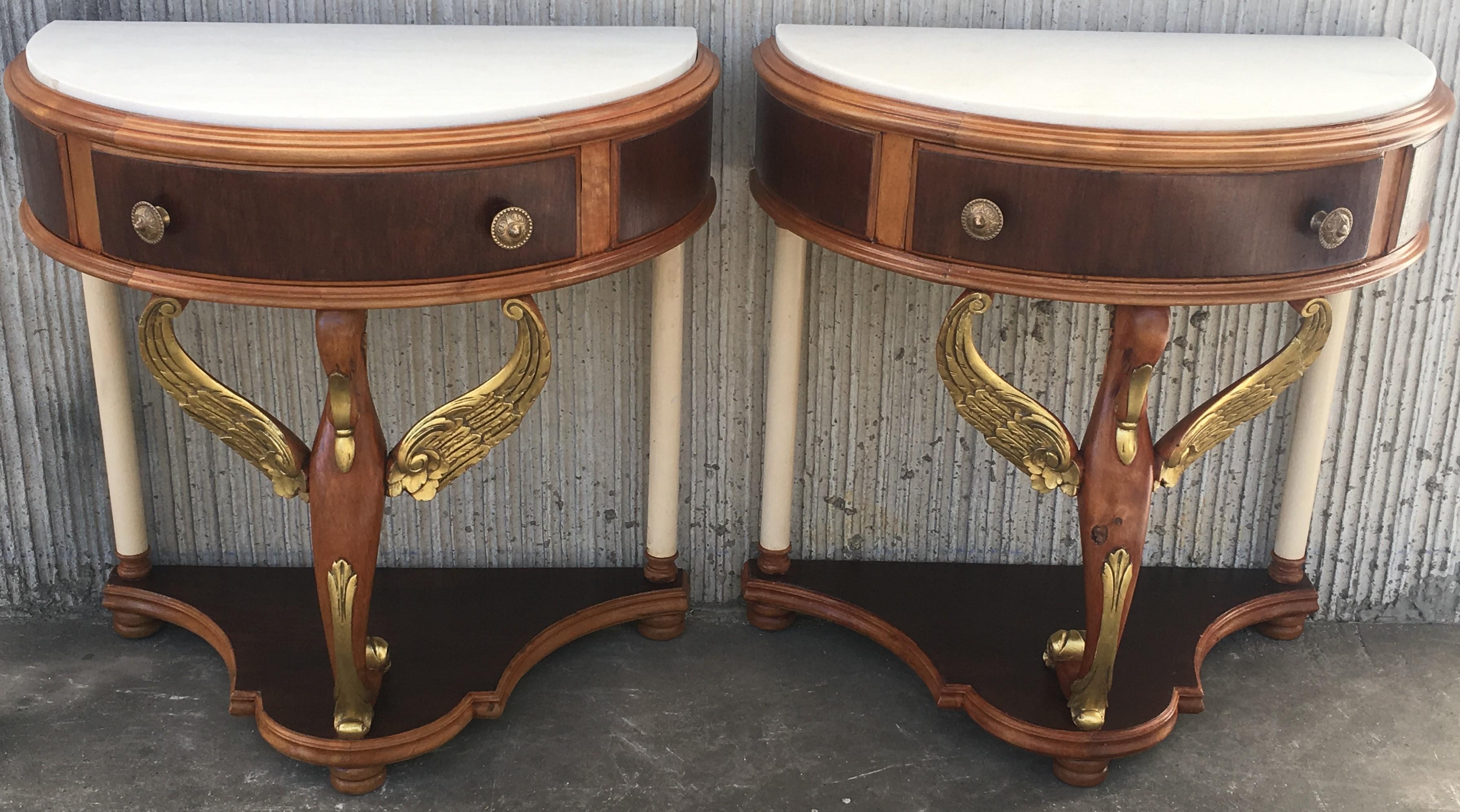 20th century pair of demilune swan nightstands with white marble top
completely restored.