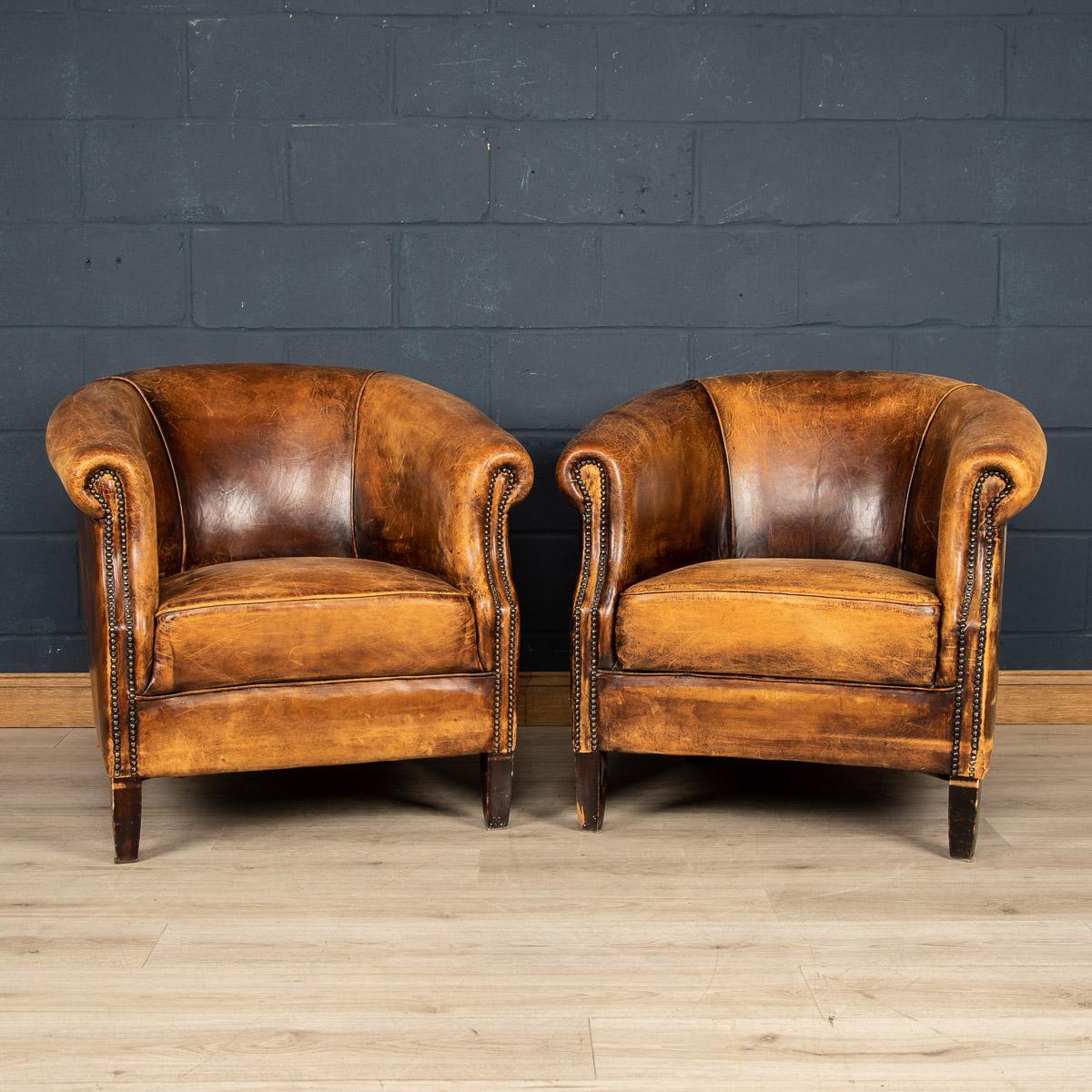 Showing superb patina and colour, this wonderful pair of club chairs were hand upholstered sheepskin leather in Holland by the finest craftsmen in the latter part of the 20th century.

Condition
In good condition - some wear consistent with