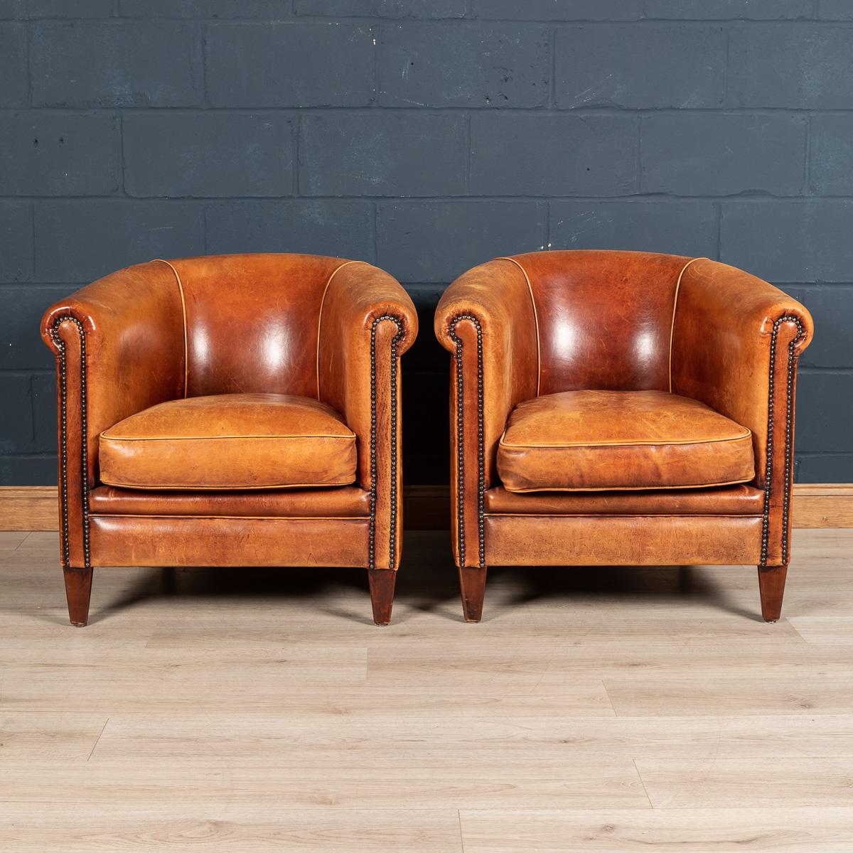 Showing superb patina and colour, this wonderful pair of tub chairs were hand upholstered sheepskin leather in Holland by the finest craftsmen. Fantastic look for any interior, both modern and traditional.

Please note that our interior pieces are