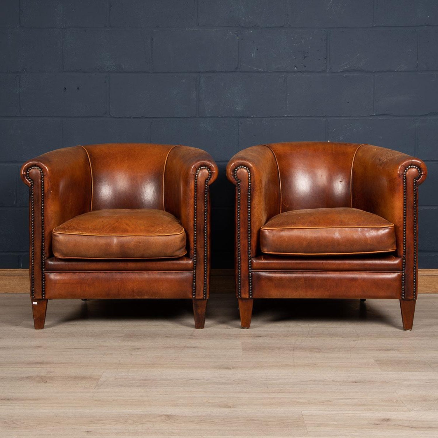 20th century pair of dutch sheepskin leather tub chairs