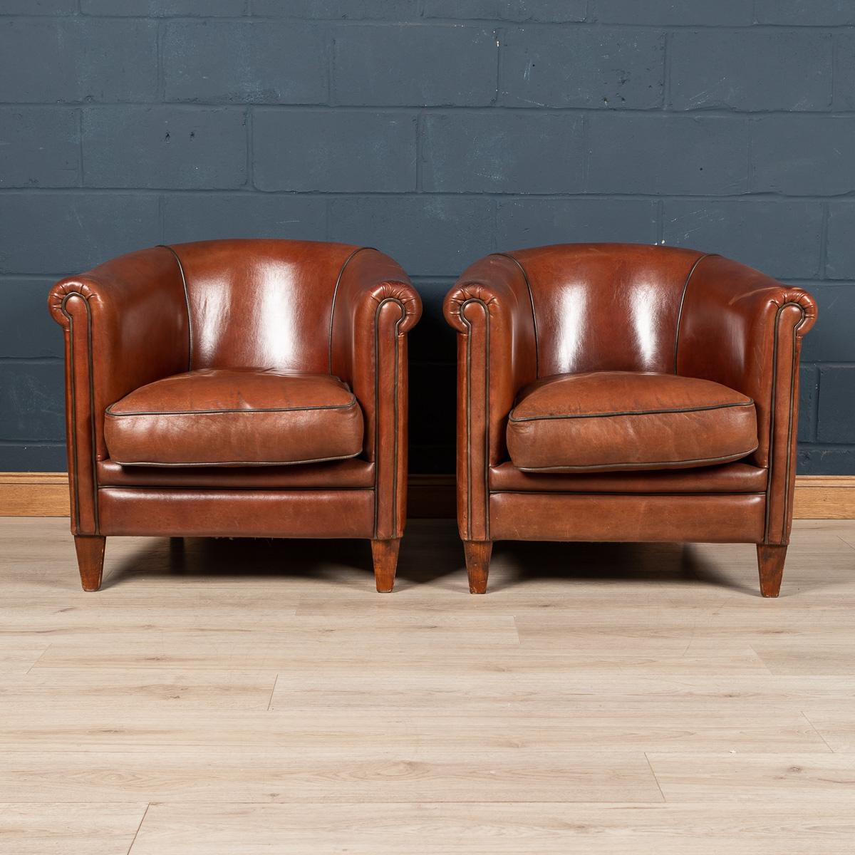 Showing superb patina and colour, this wonderful pair of tub chairs were hand upholstered sheepskin leather in Holland by the finest craftsmen. Fantastic look for any interior, both modern and traditional.

Please note that our interior pieces are