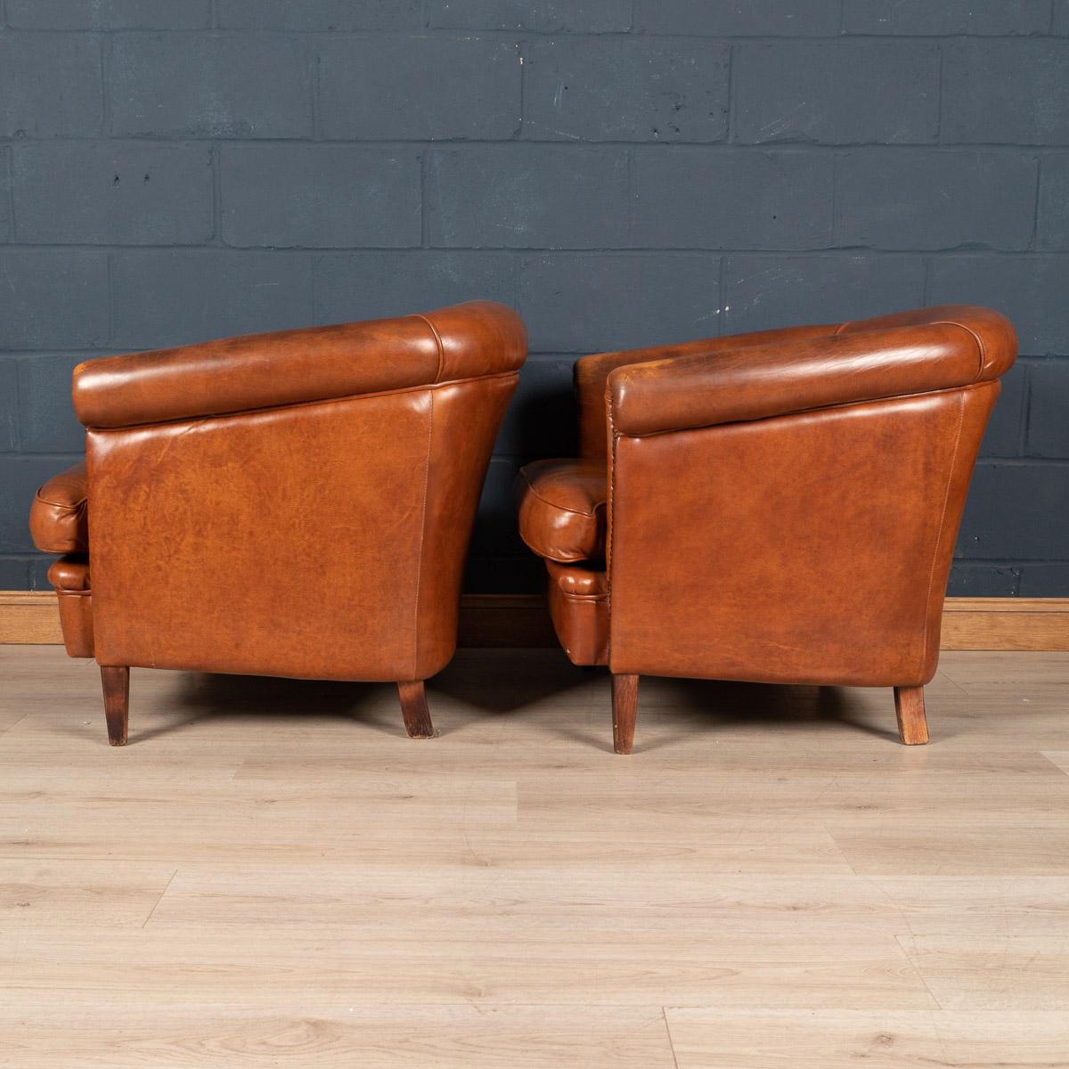 Showing superb patina and colour, this wonderful pair of tub chairs were hand upholstered sheepskin leather in Holland by the finest craftsmen. Fantastic look for any interior, both modern and traditional.

Condition

In good condition - wear