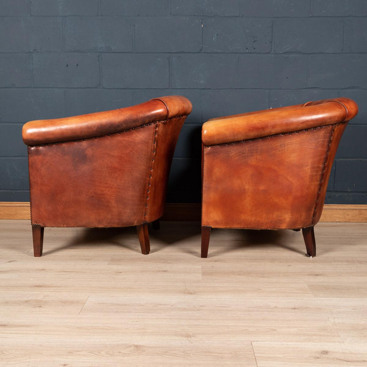 Showing superb patina and colour, this wonderful pair of tub chairs were hand upholstered sheepskin leather in Holland by the finest craftsmen. Fantastic look for any interior, both modern and traditional.

Condition

In good condition - wear