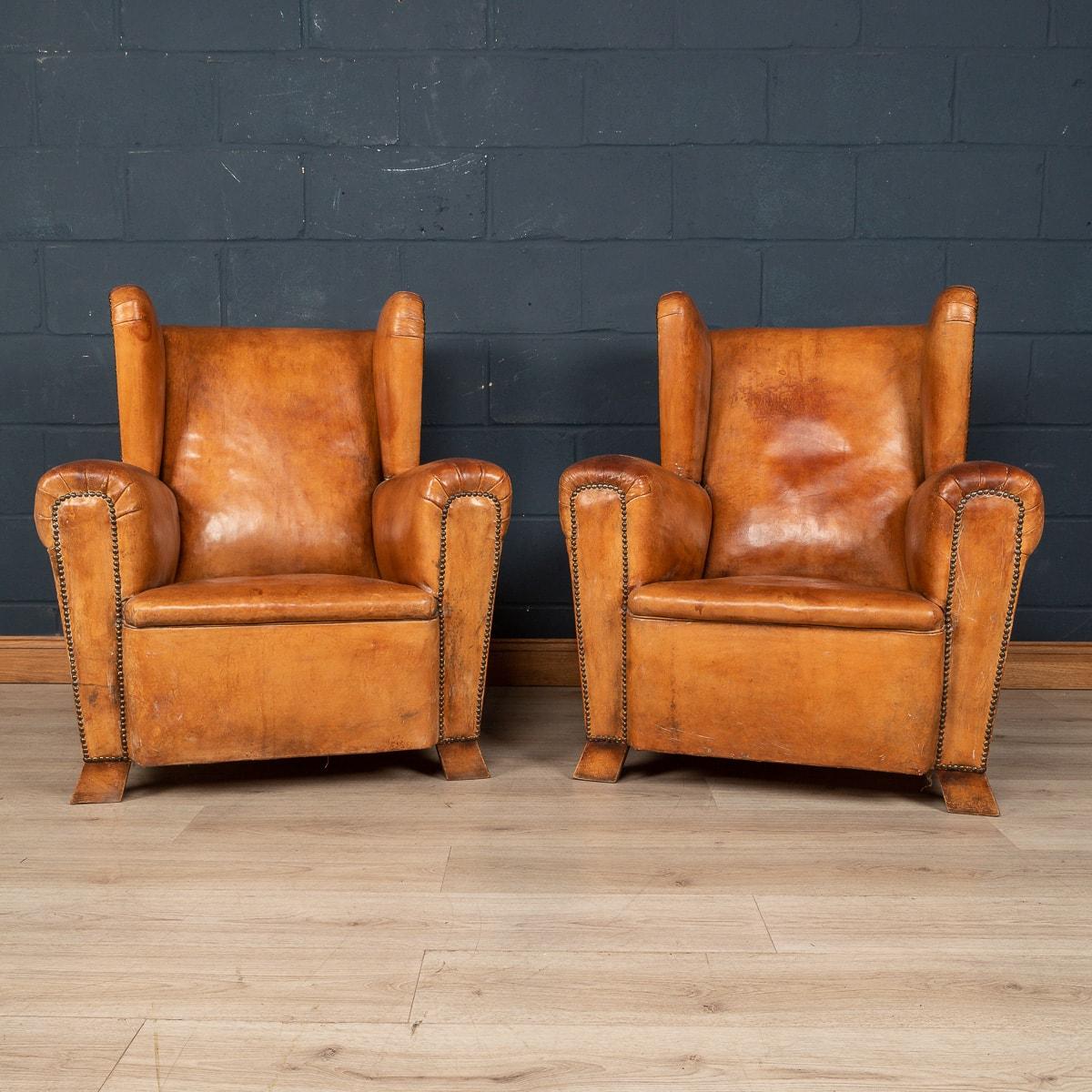 A gorgeous pair of French leather wing back chairs, circa 1880/1900. Structurally sound, superb quality, these chairs are of the finest quality and perennially ooze class and sophistication, extremely comfortable, and suit any style of
