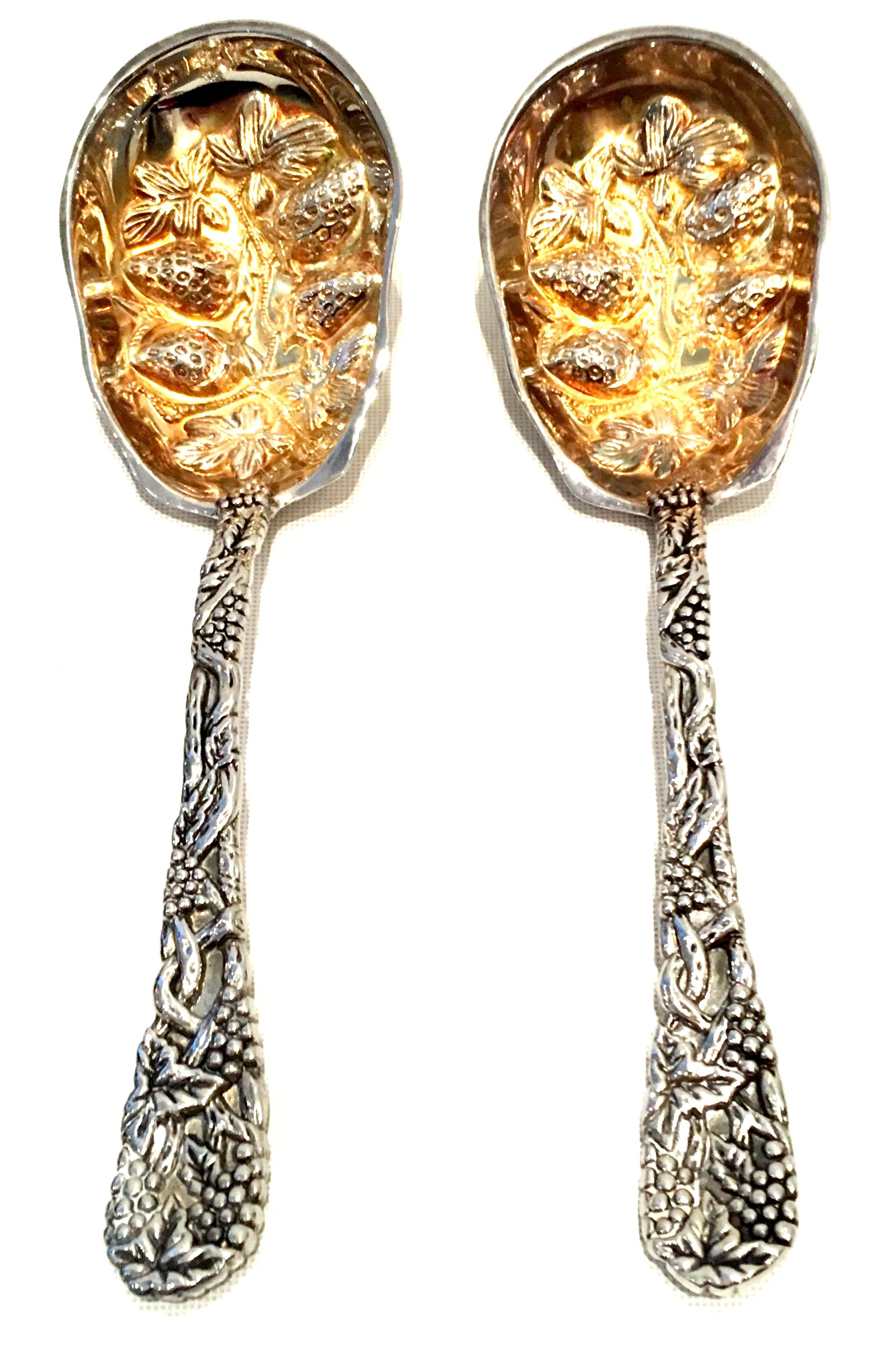 20th Century Pair Of Godinger For Neiman Marcus Silver Plate Serving Spoons S/2. Includes the original green velvet Neiman Marcus logo gift box and care card. New or like new. 
Each piece is signed, Godinger.
The gold tone patina can be polished