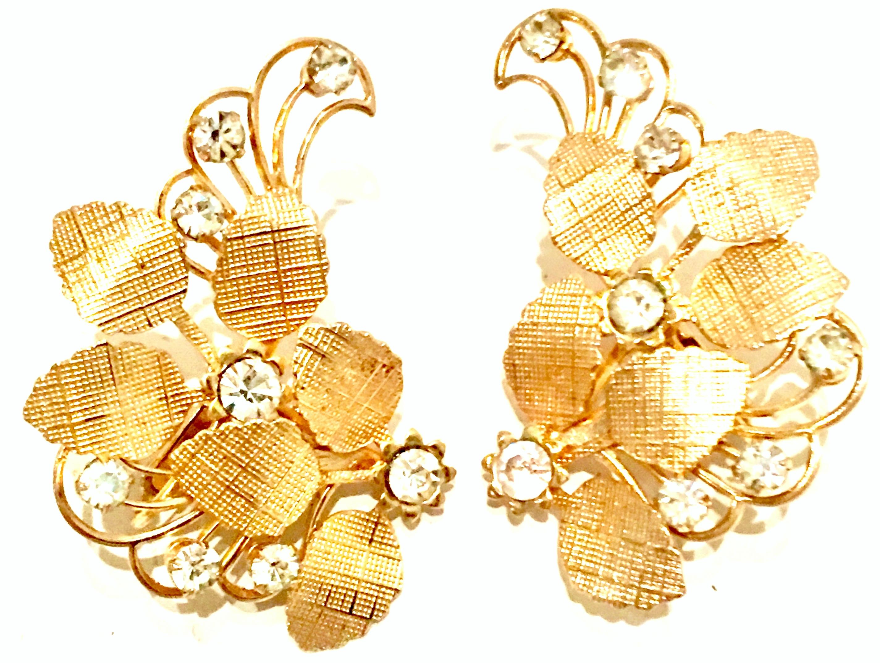20th Century Pair Of Gold Plate & Austrian Crystal Abstract Floral Earrings.These clip style earrings feature a dimensional 