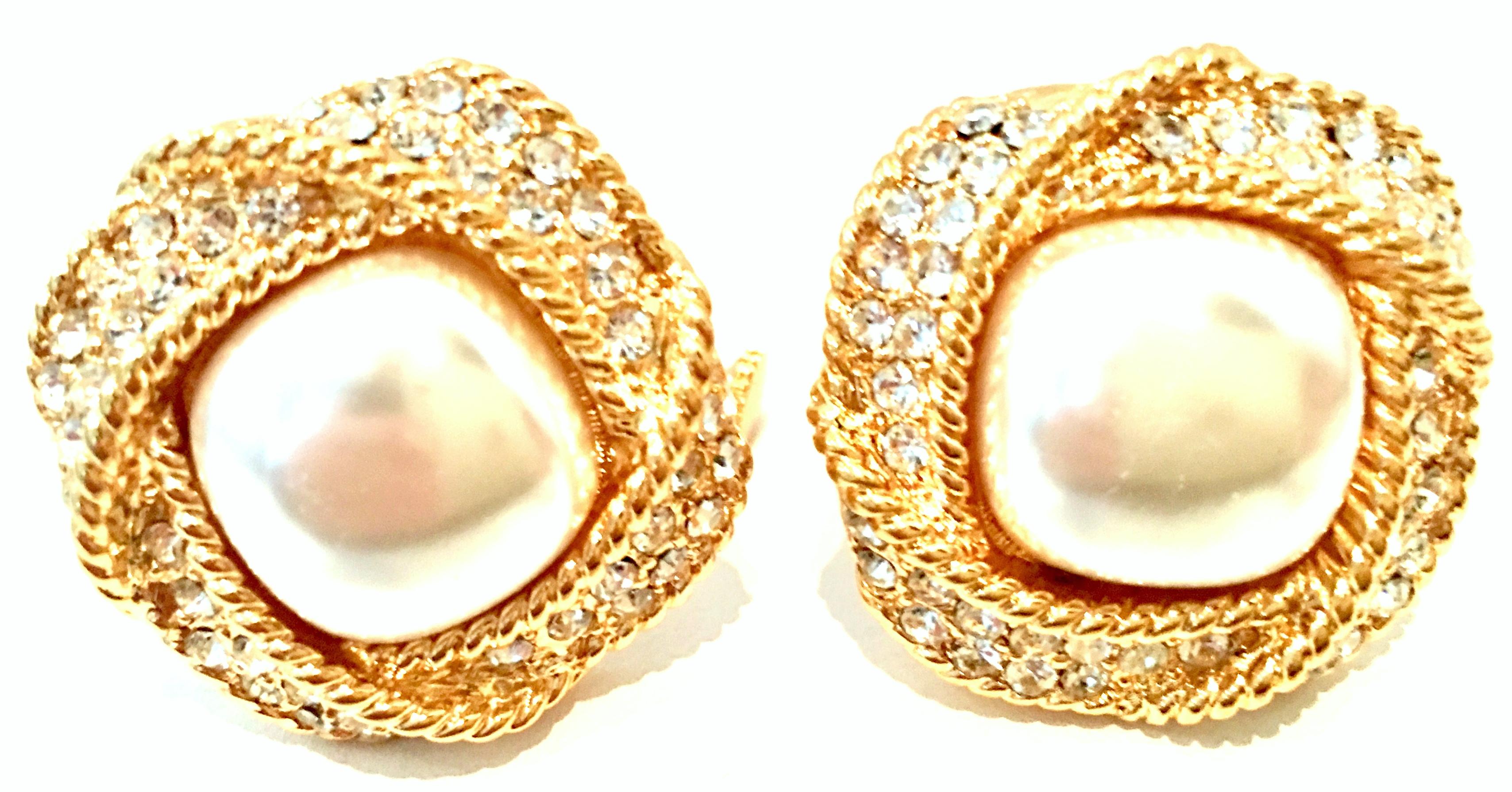 20th Century Pair Of Gold Plate, Faux Pearl & Austrian Crystal Dimensional Earrings By, Napier. These finely crafted gold plate dimensional pair of Napier earrings features a central large white faux pearl, surrounded by brilliant cut and faceted