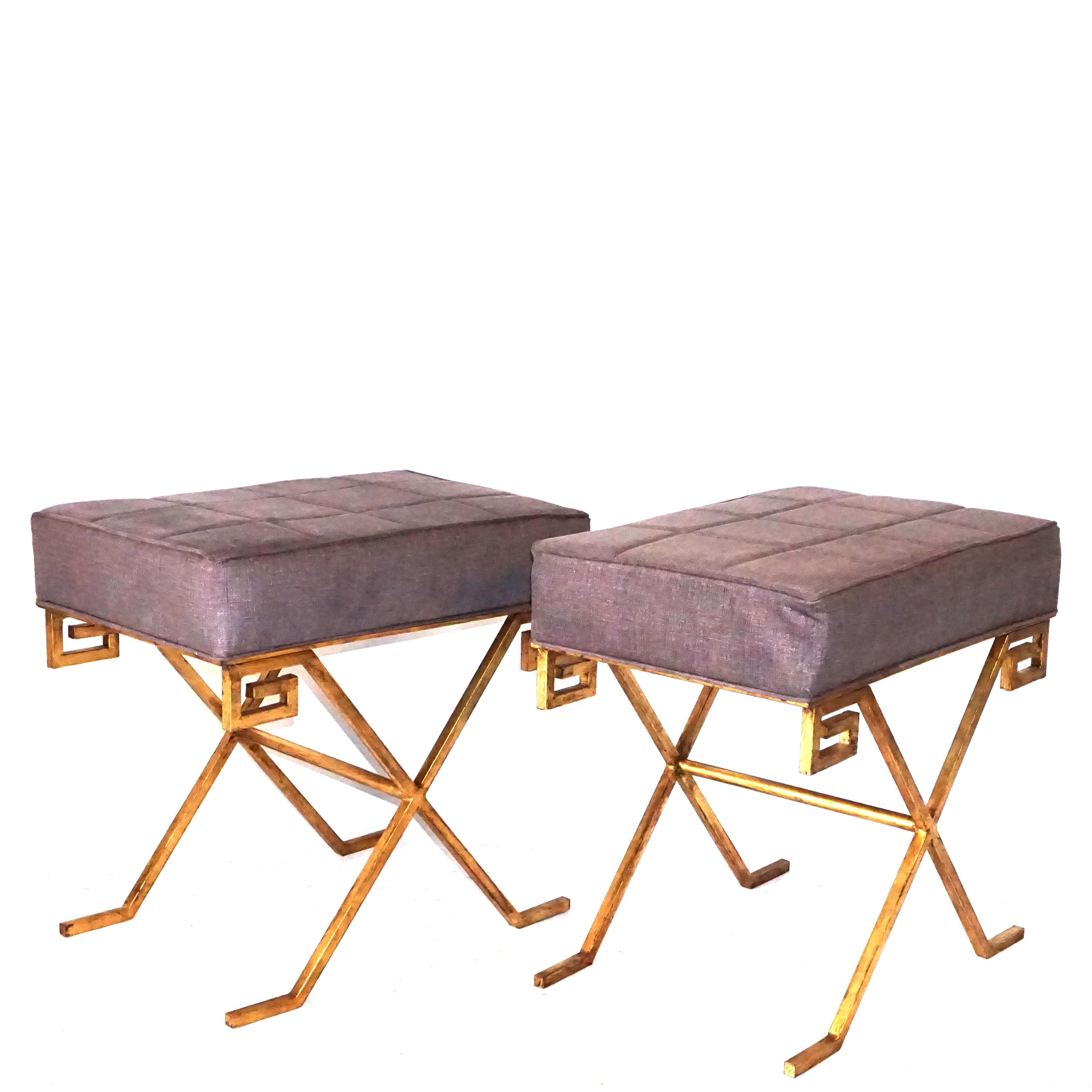 A vintage Art Deco pair of French gilt iron benches, upholstered with seat support on an X-form base with a Greek key design. Designed by Jean Michel Frank, in good condition. Wear consistent with age and use, circa 1920-1935, France.

Jean-Michel