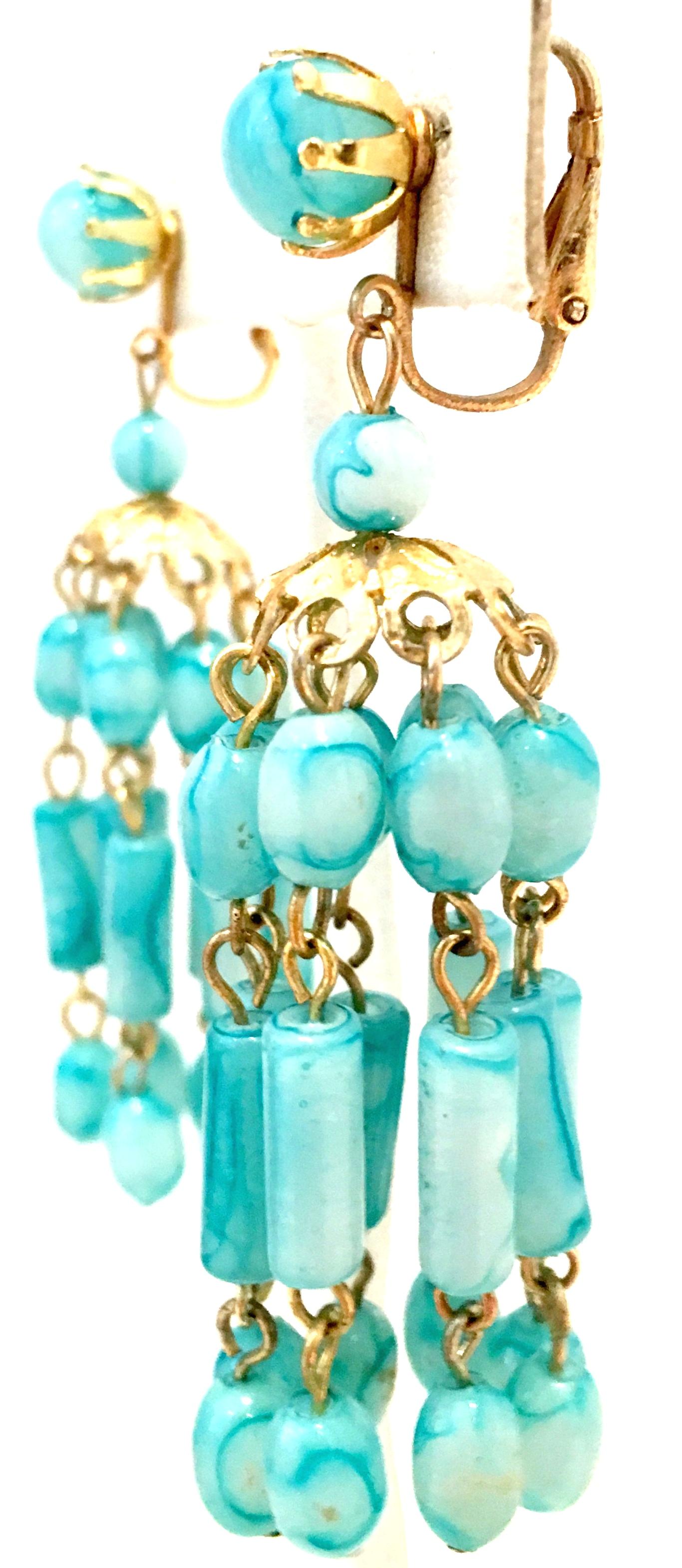 1960'S Pair Of Gold Plate & Lucite Bead Dangle Earrings-Hong Kong. These clip style earrings feature gold plate metal with blue marbleized beads. Marked on the underside of the clip, Hong Kong.