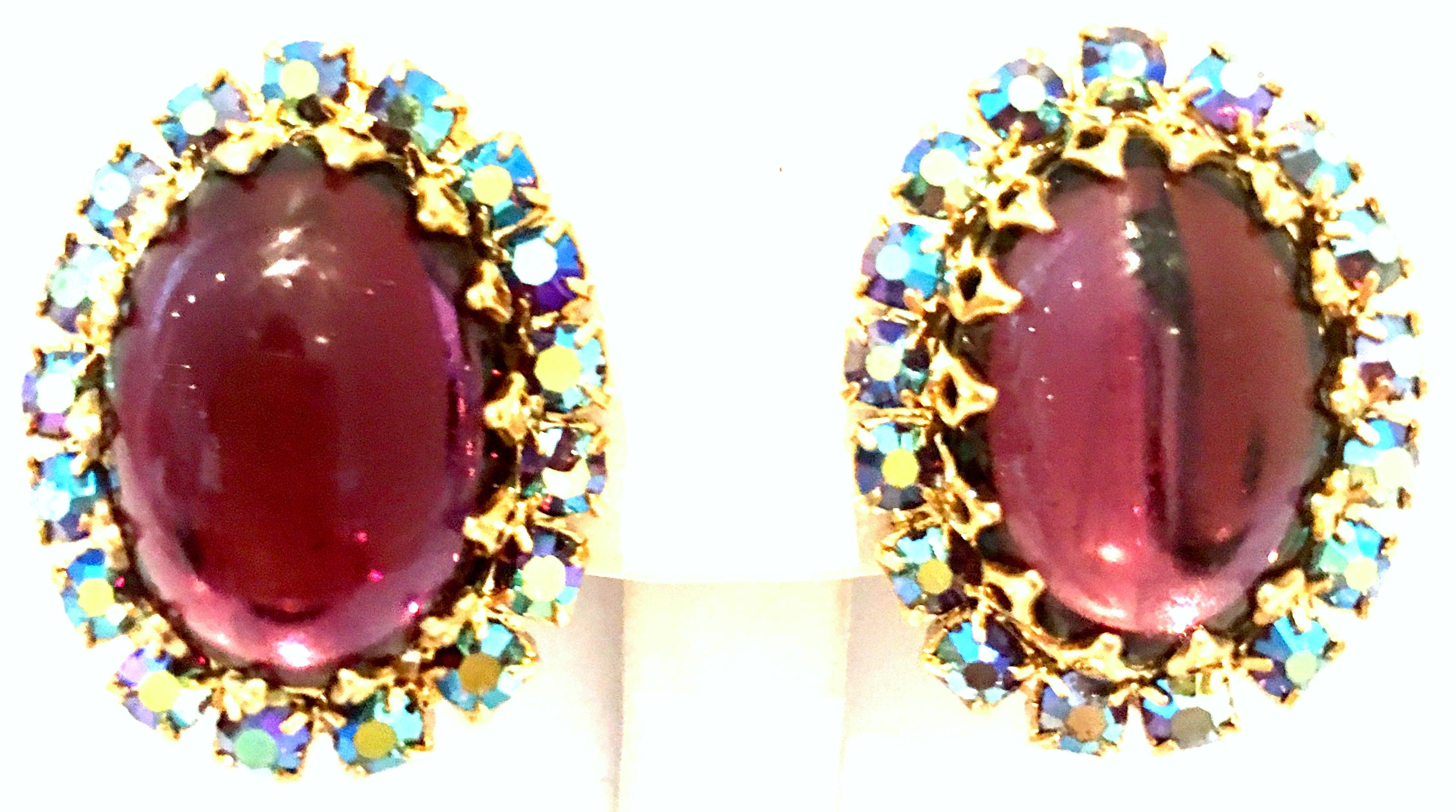 20th Century Pair Of Gold, Molded Glass & Austrian Crystal Earrings. These clip style earrings feature gold plate fancy prong set Amethyst Molded glass with Aurora Borealis Crystal stone detail.