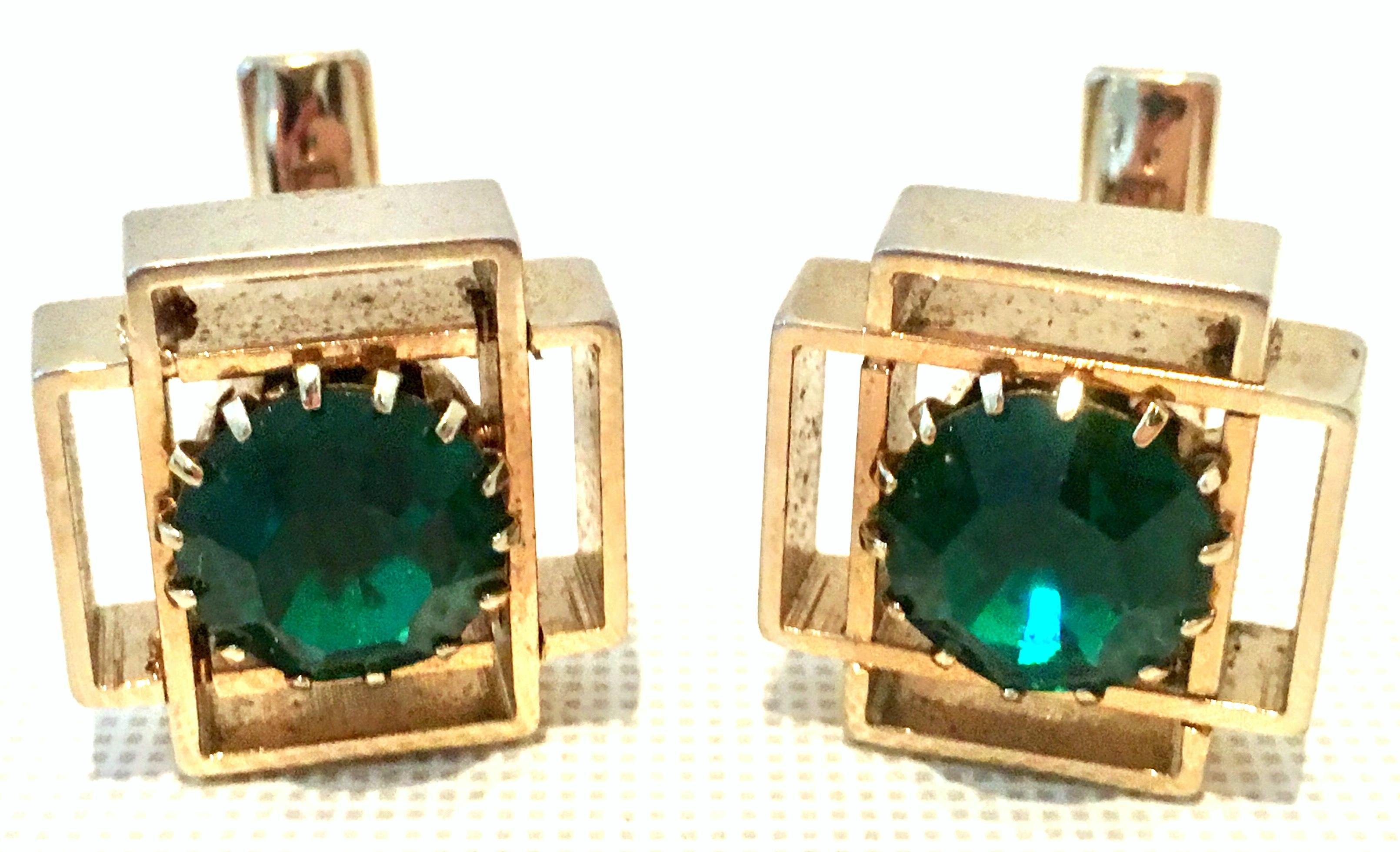 20th Century Pair Of Gold Plate & Austrian Crystal Geometric Cufflinks. Features a gold plate geometric shape with prong set cut and faceted brilliant emerald Austrian crystal stone. Each piece is signed on the underside with a patent number.