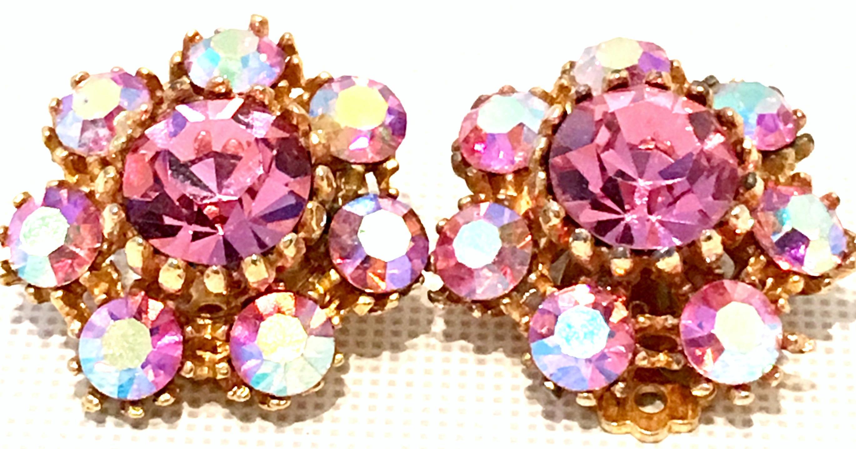 20th Century Pair Of Gold Plate & Swarovski Crystal Earrings. Features fancy prong set cut and faceted brilliant sapphire pink central stone, surrounded by pink Aurora Borealis stones. 