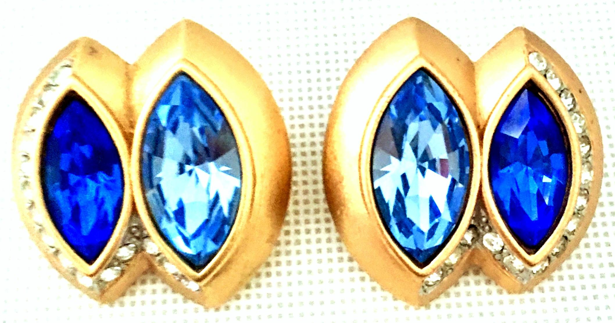 20th Century Pair Of Gold & Sapphire Blue Swarovski Crystal Earrings By, Monet. These pierced style brushed gold plate abstract 