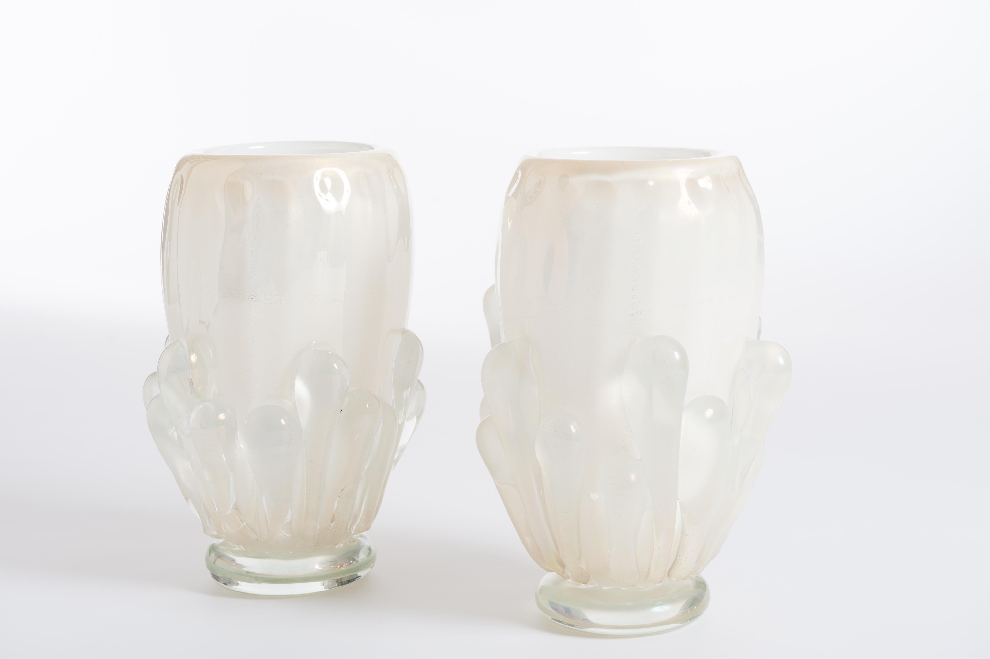 A pair of modern ribbed Italian Murano opal glass vases gold-white-iriscent colored with surreal impression.
Murano handblown vases made by prestigious Italian glassblower, Sergio Costantini. 
The conic shaped body shows enormous glass drops outside