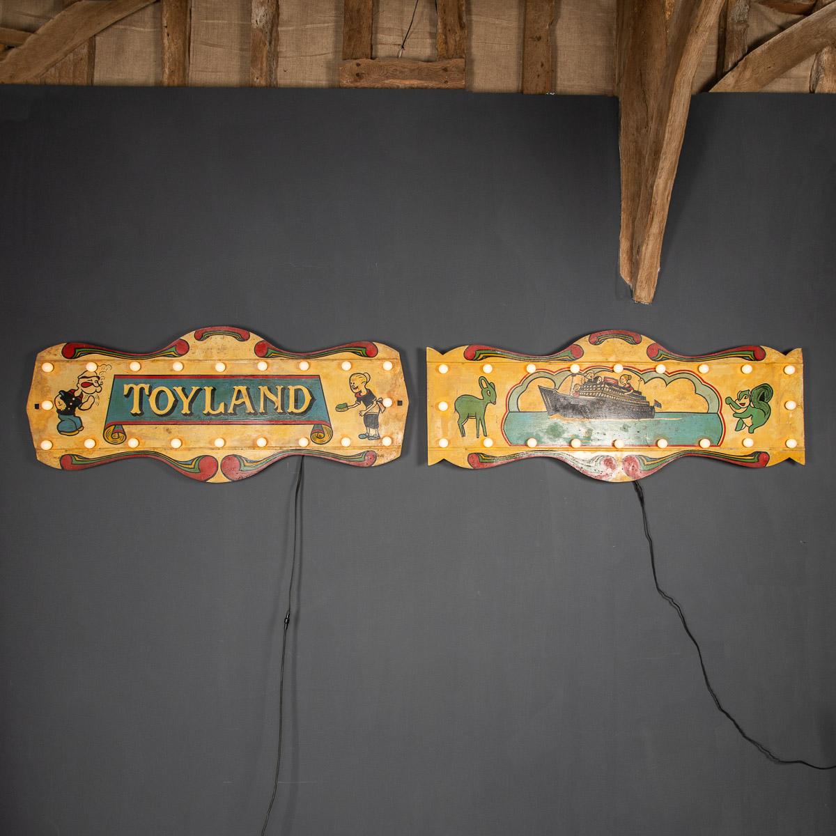 Antique 20th century pair of metal painted fairground signs. Each sign is illuminated with twenty bulbs and have been adapted to hang on the wall. A real conversation piece.

Condition
In great condition - wear as expected.

Size
Width: